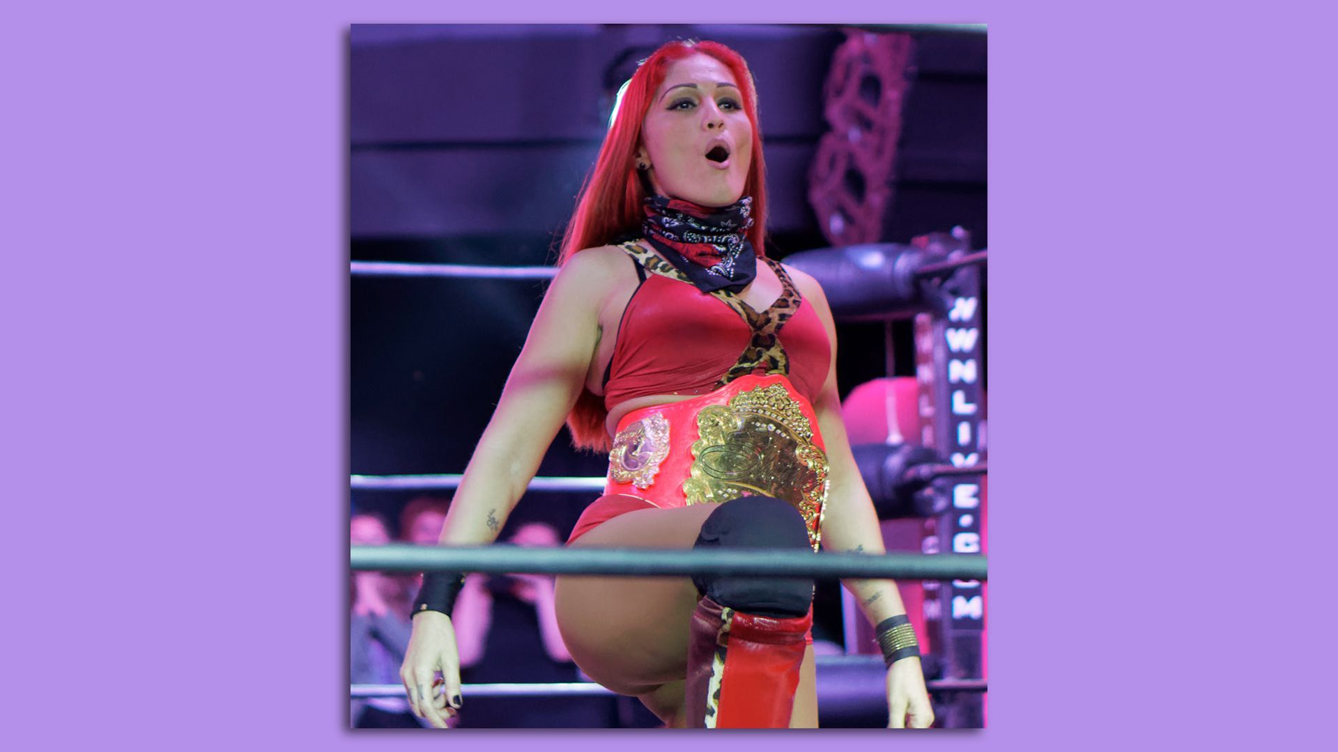 Ivelisse Velez performs a move in the wrestling arena.