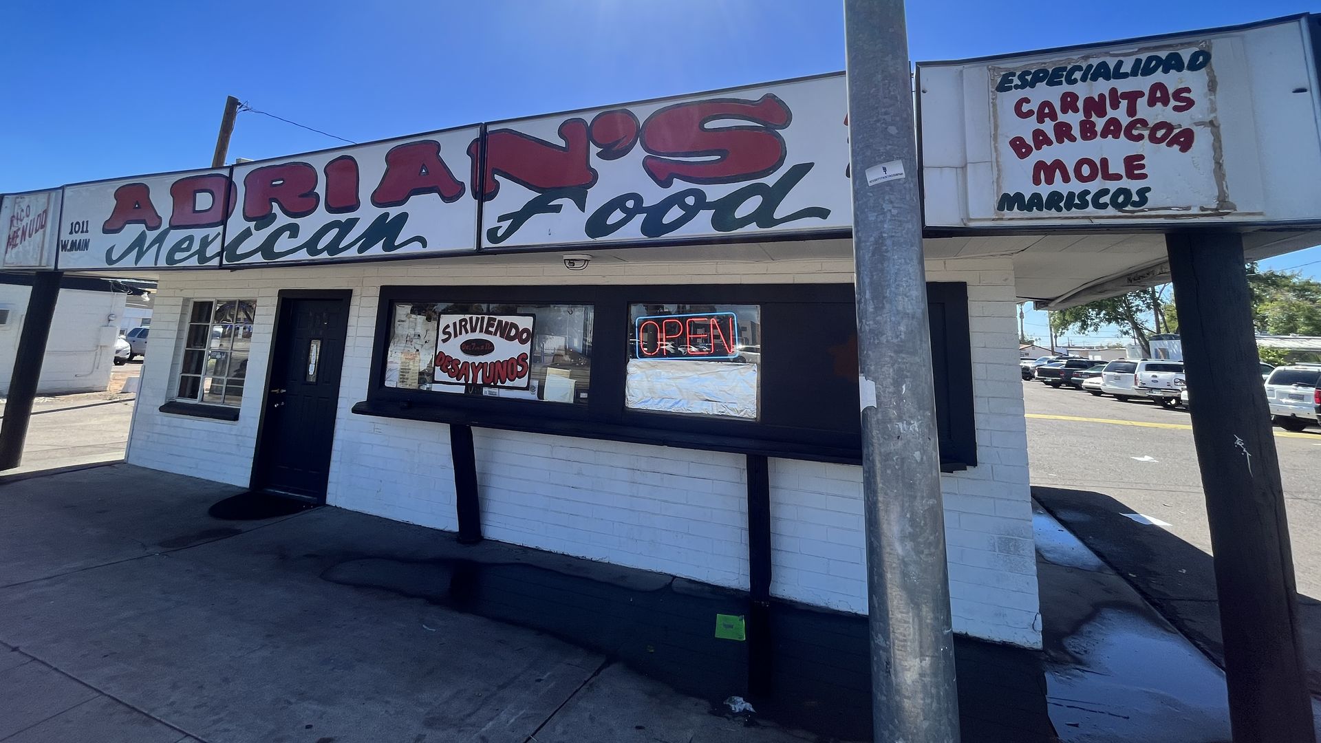A small restaurant that says, "Adrian's Mexican Food." 