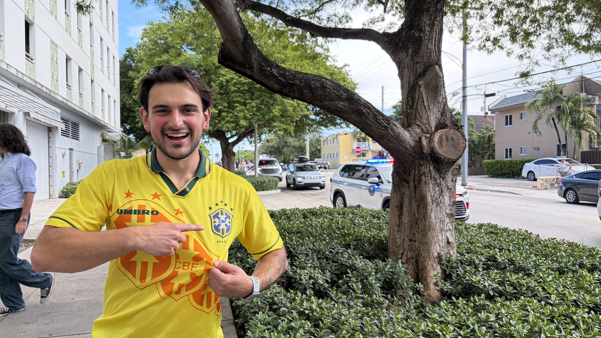 Brazilian fan Nick Barbosa poses with his soccer jersey.