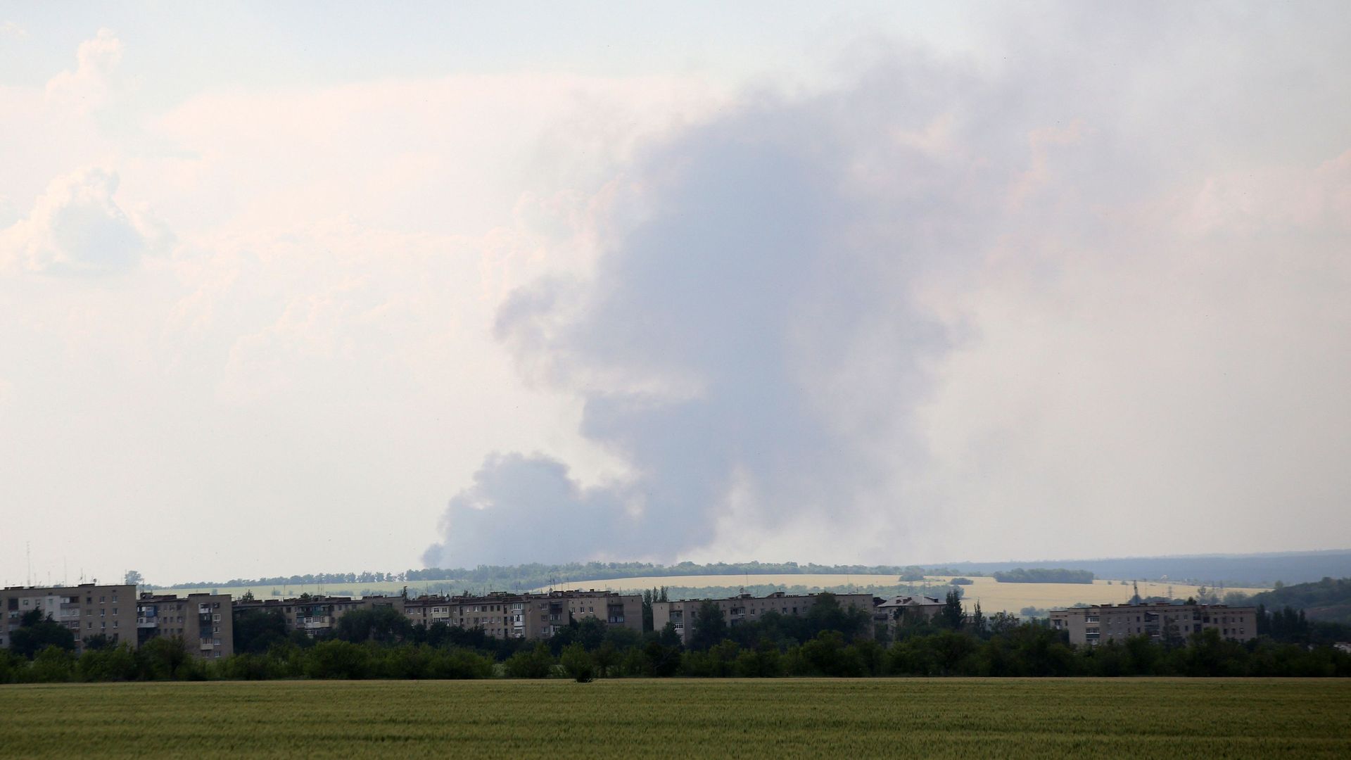 Black smoke is seen over the city of Lyman, Donetsk region.