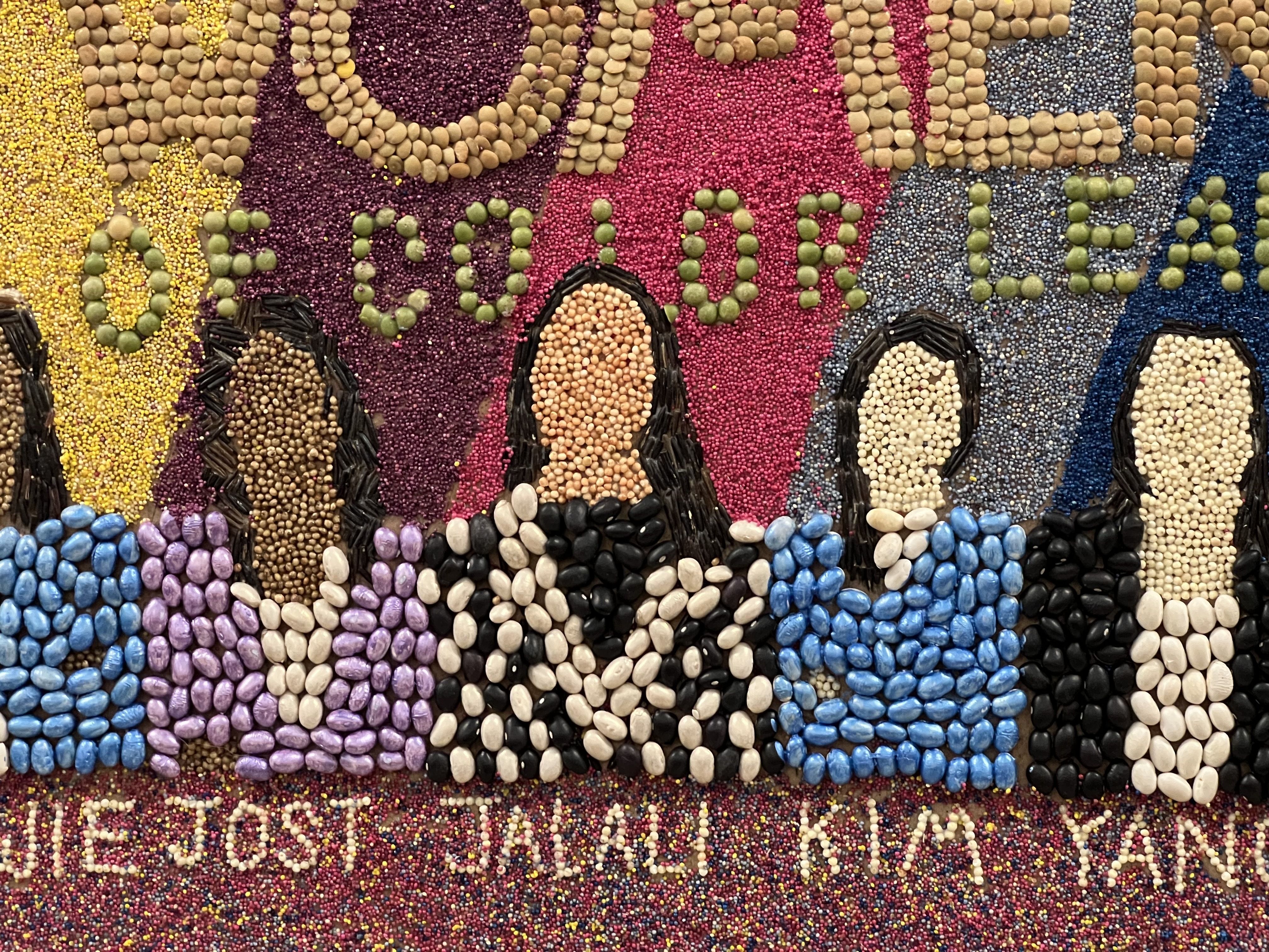 An up-close image of seed art depicting, in the frame, five of the seven women members of the St. Paul City Council.