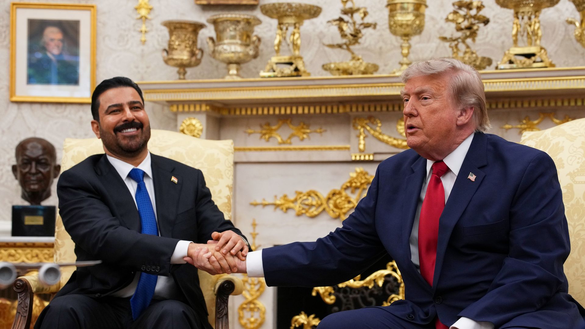 President Trump shakes hands with Iraqi Prime Minister Ali al-Zaidi in the Oval Office Tuesday.