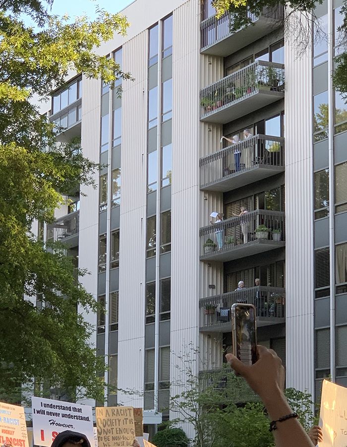 cheering from the towers on Justice Walk in Myers Park