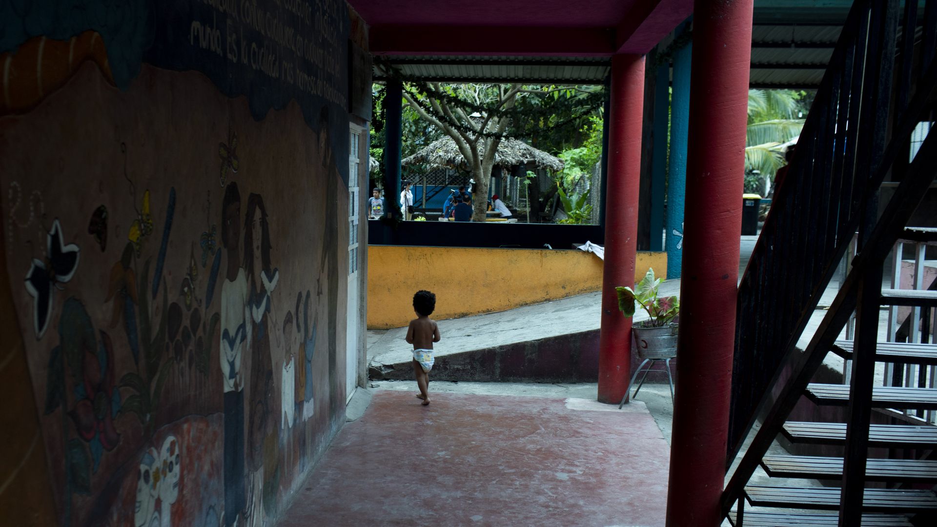 A child walks outside a shelter for migrants in Tenosique, Tabasco state, Mexico, on Monday, March 9