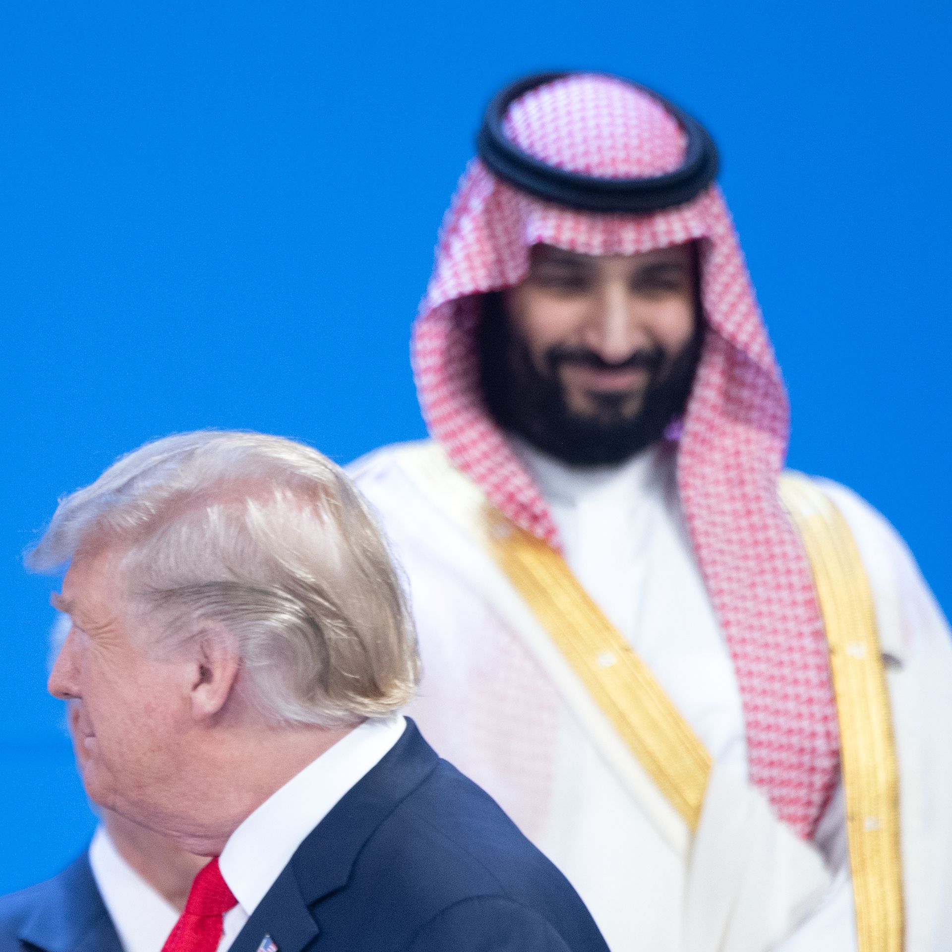 Donald Trump walks past the smiling Mohammed bin Salman at the G20 Summit Meeting Center in Buenos Aires 