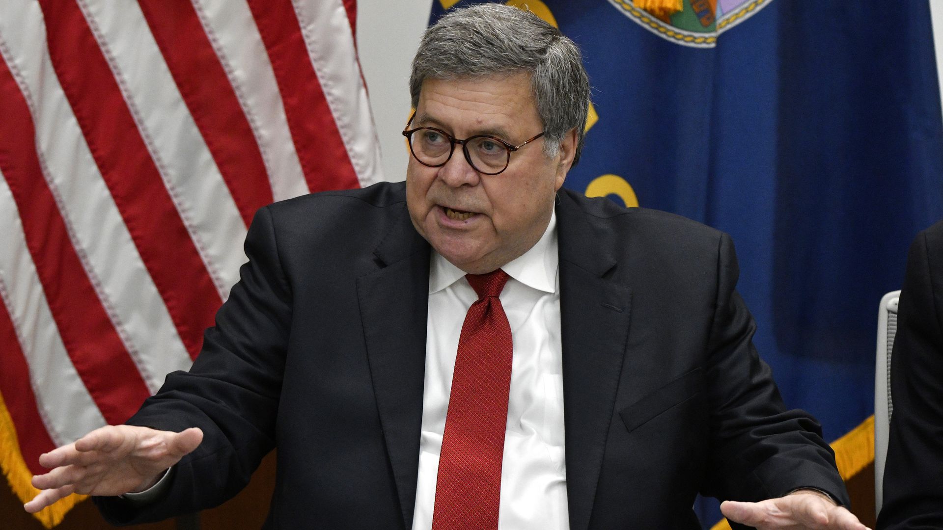 attorney general bill barr in a suit and tie