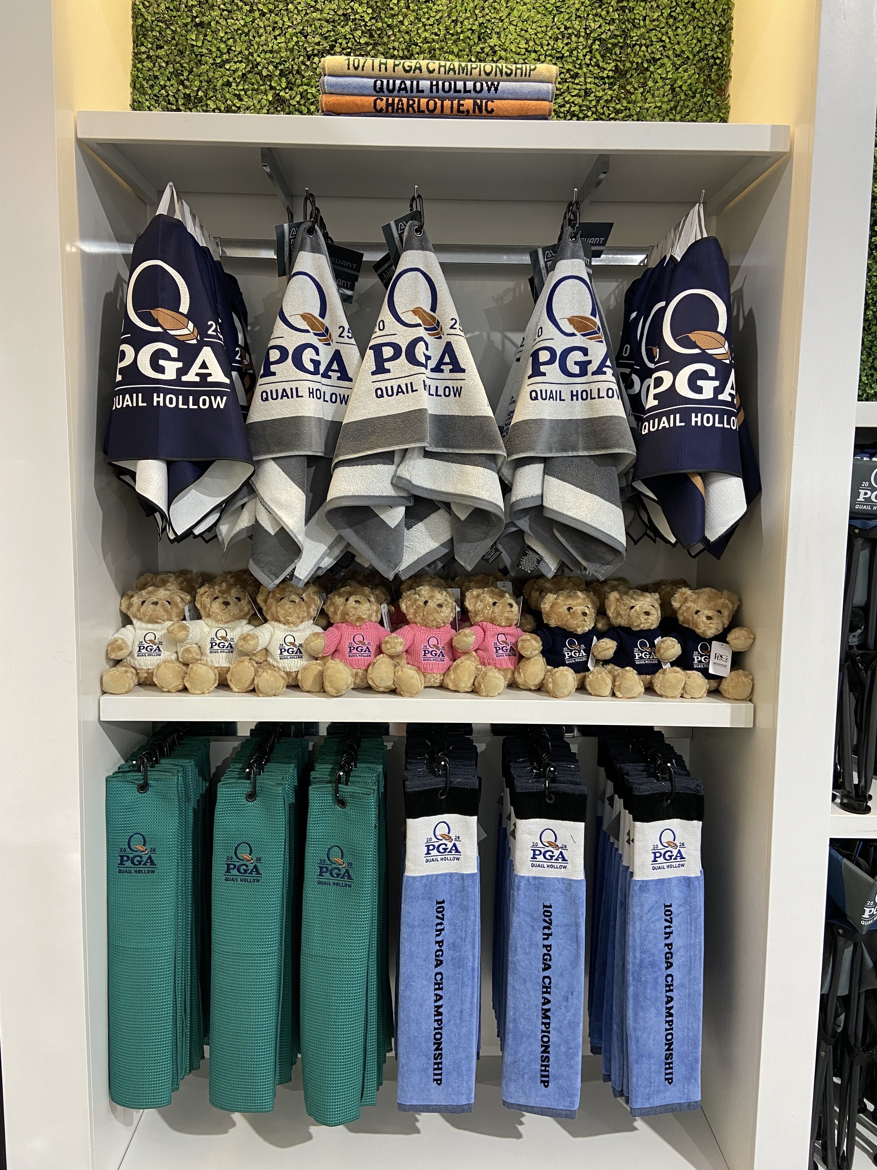Teddy bears and golf towels with the PGA Championship logo.