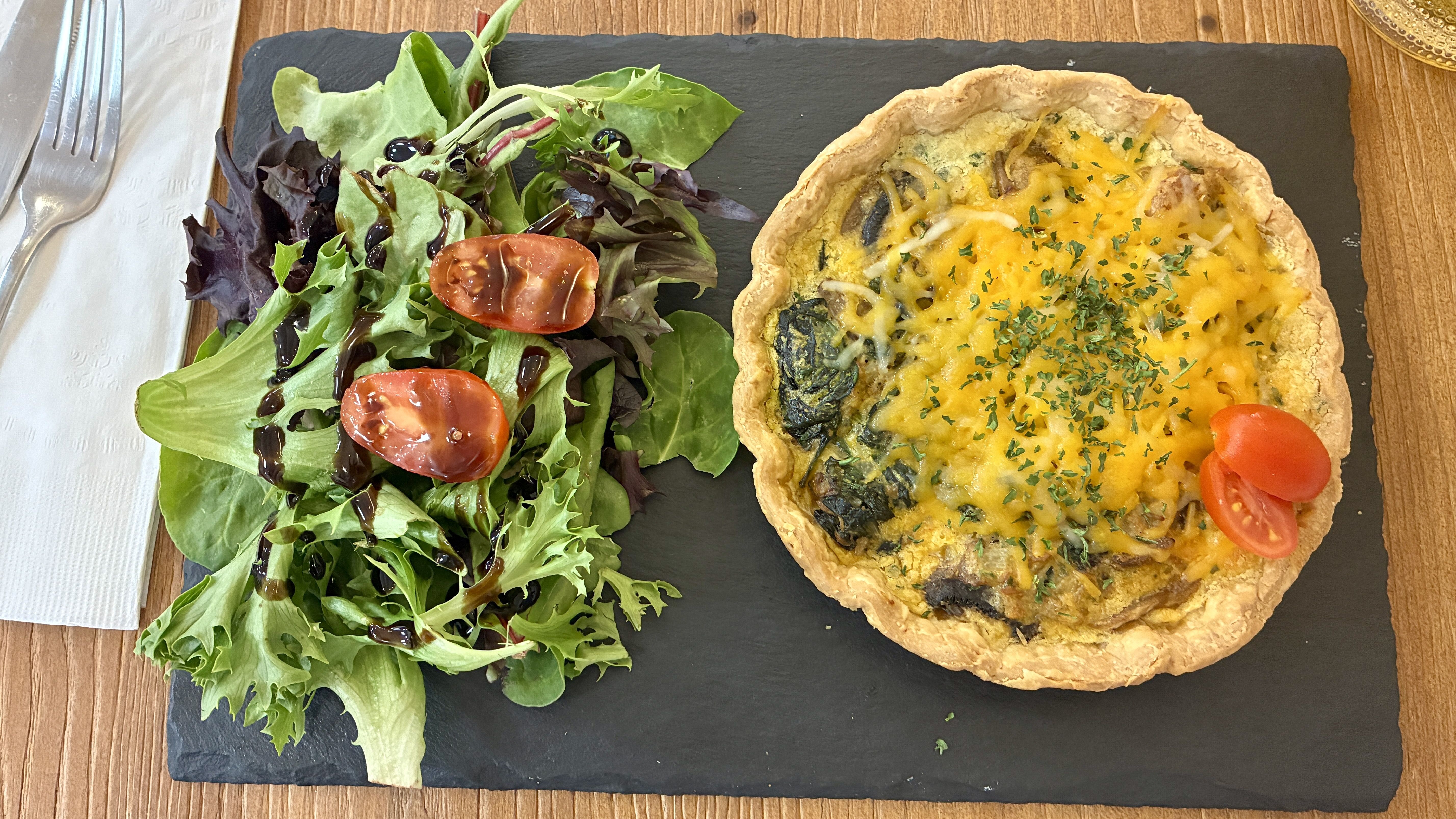 A mushroom quiche with a simple side salad.