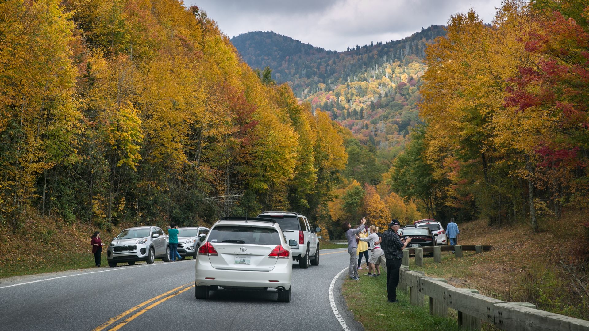 Heavy traffic greets visitors at the entrance to Great Smoky Mountains National Park on October 18, 2016 near Cherokee, North Carolina. The trees are yellow and red and green.