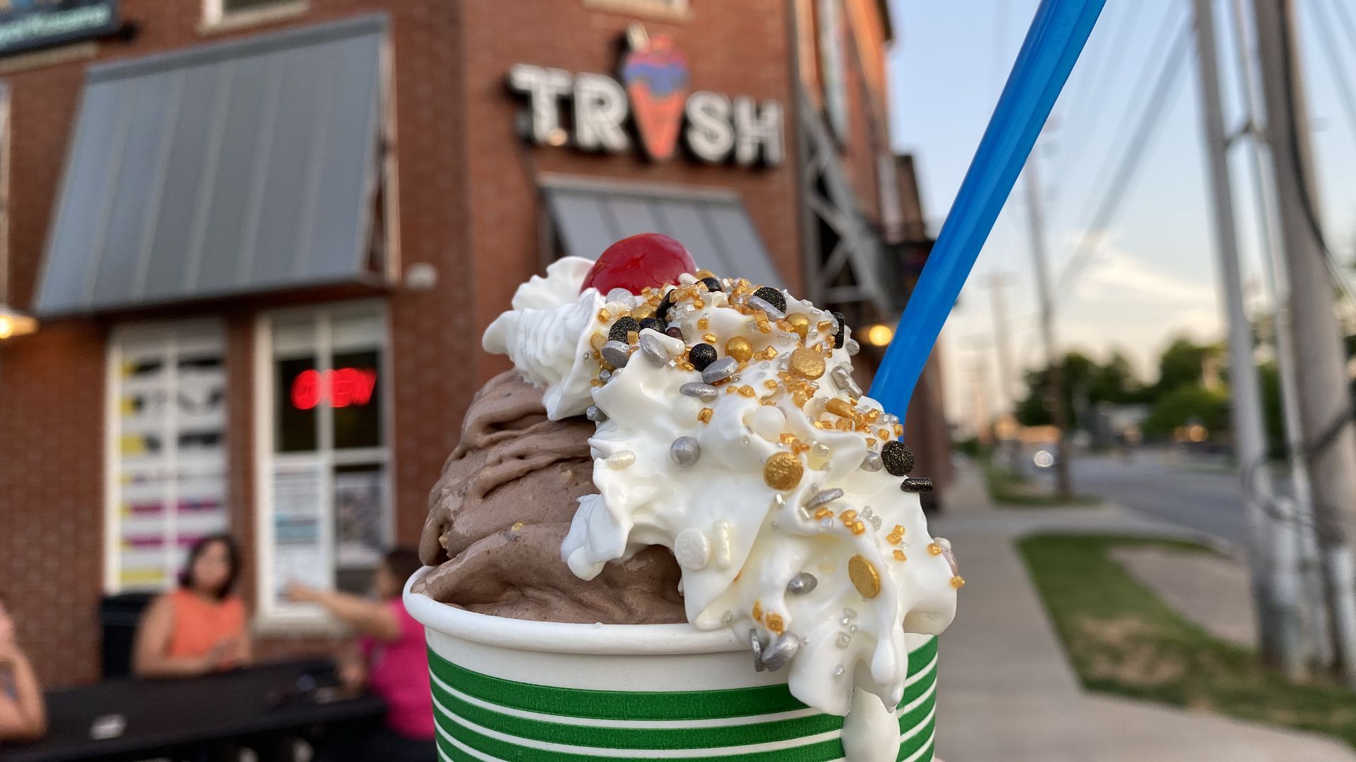 An ice cream sundae with whipped cream on top
