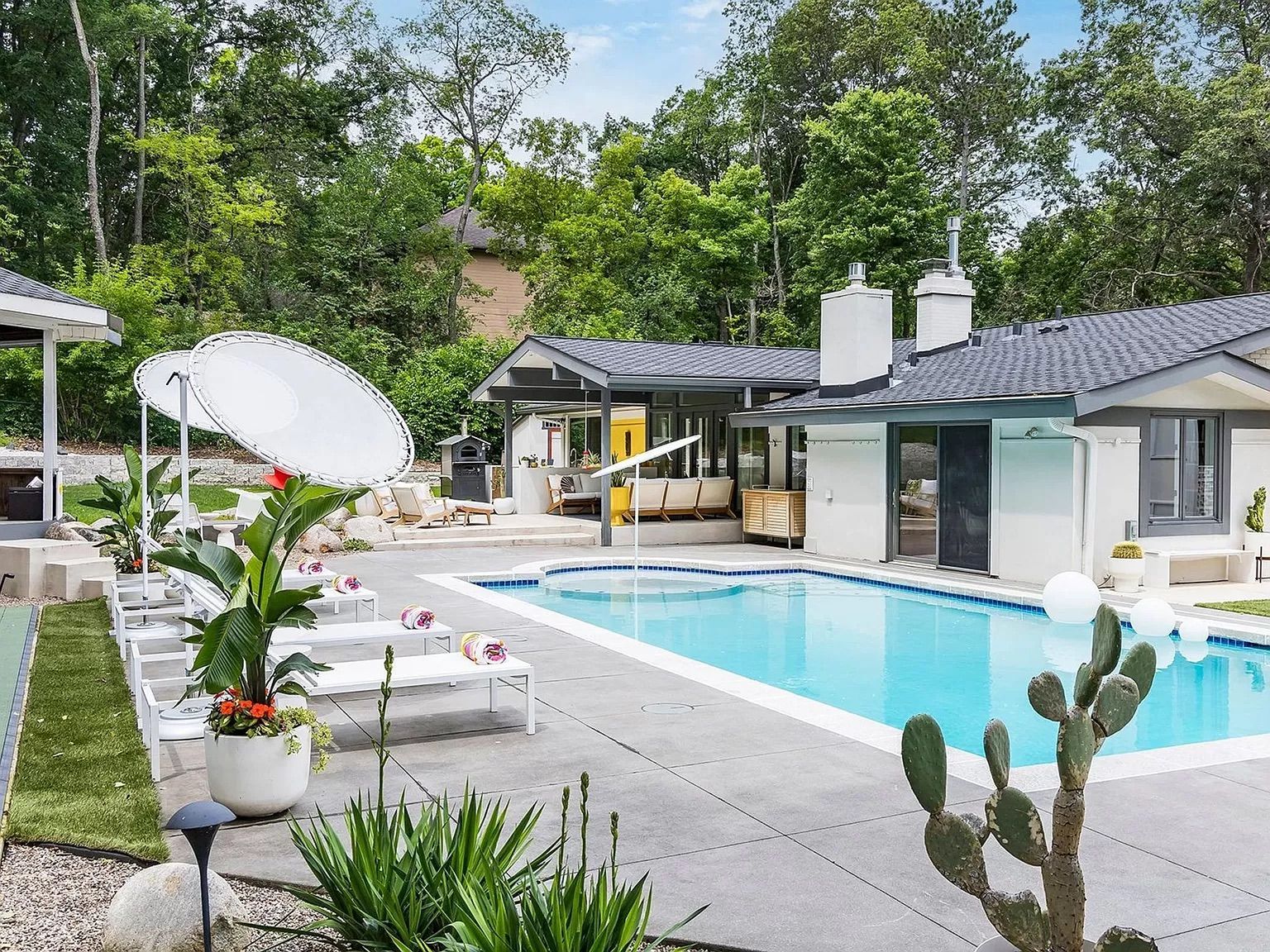 A backyard with a pool.