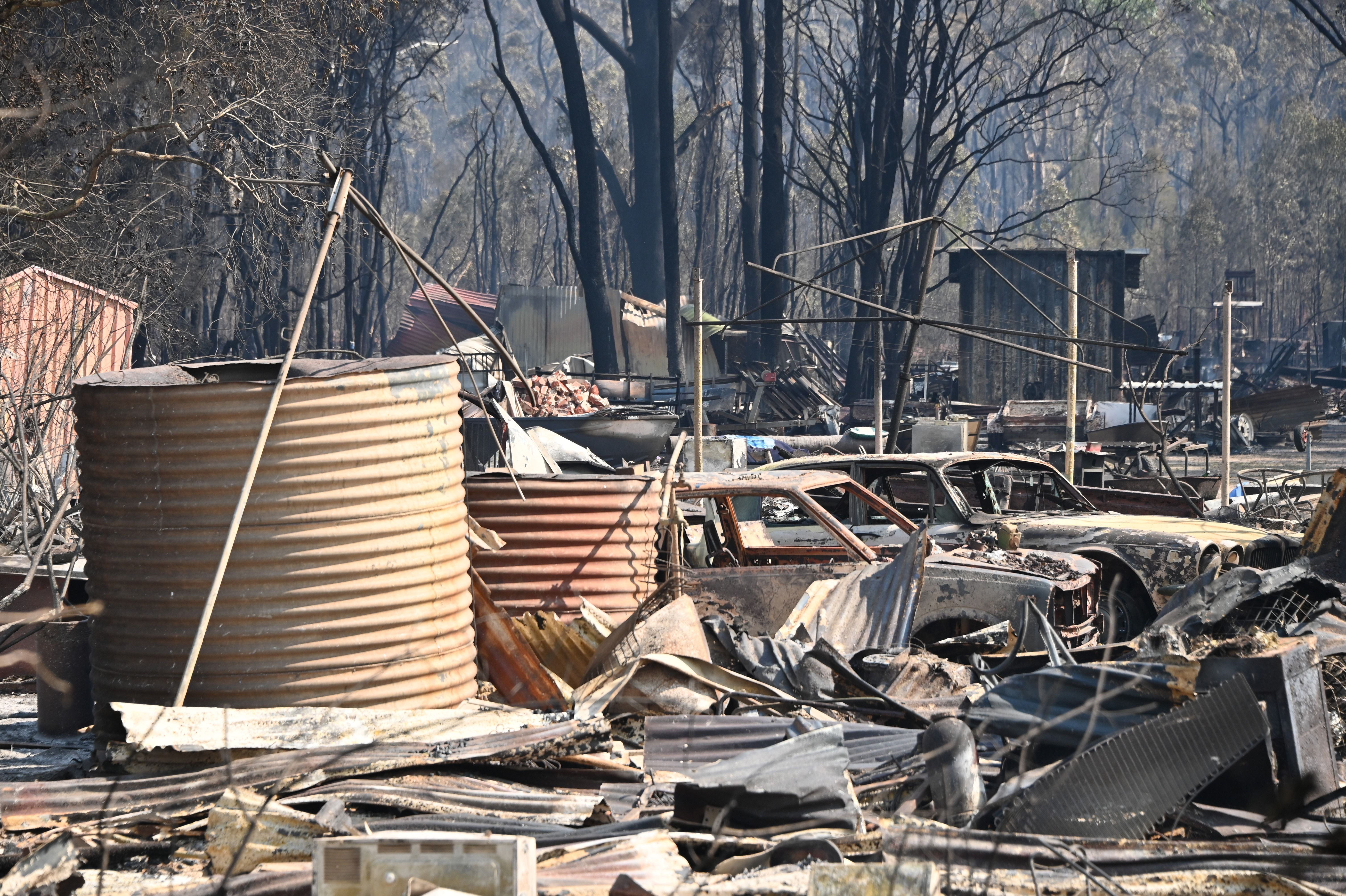 The remains of a house are seen after a bushfire destroyed a property in Old Bar, 350km north of Sydney on November 10
