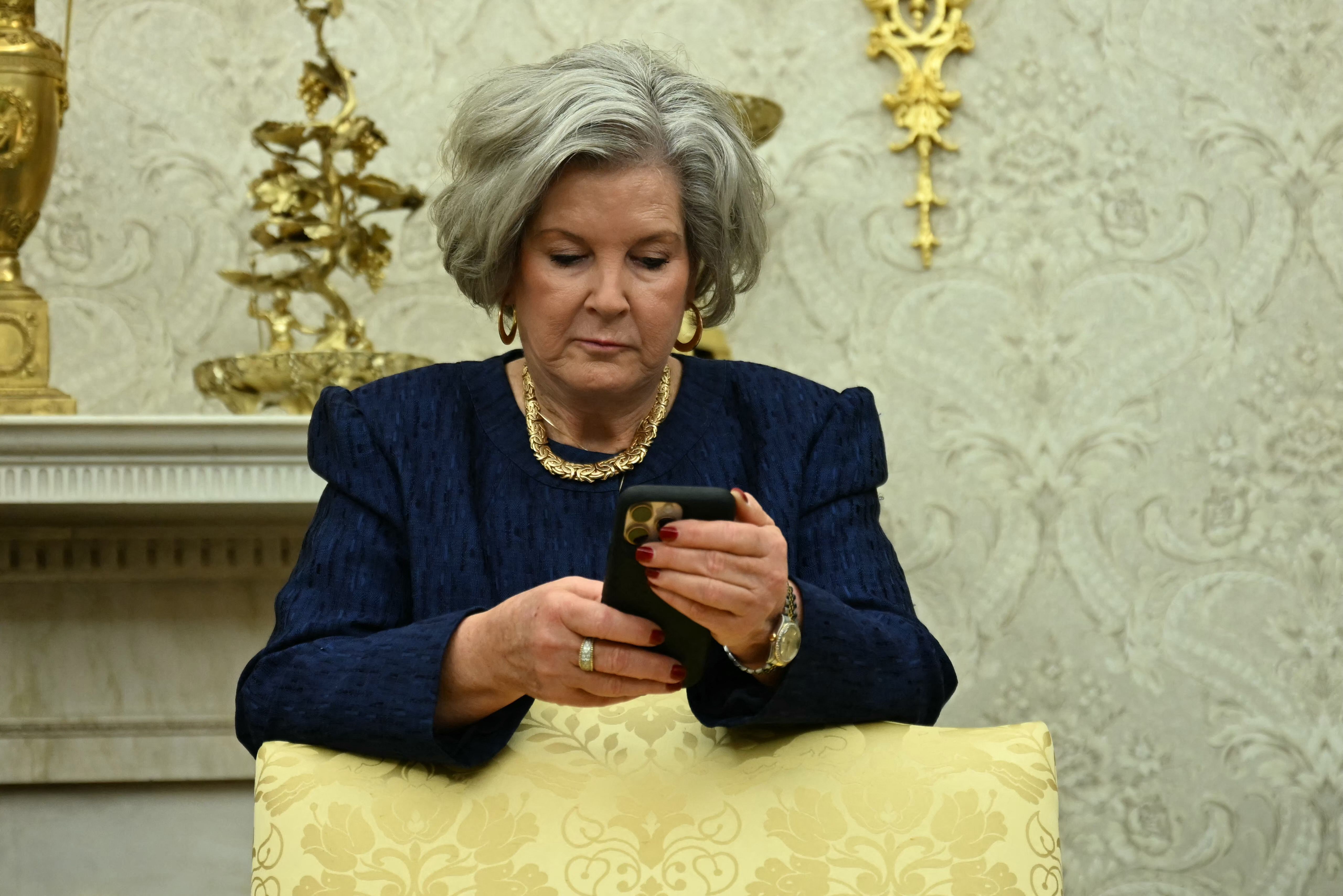 White House Chief of Staff Susie Wiles looks at her phone in the Oval Office earlier this month.