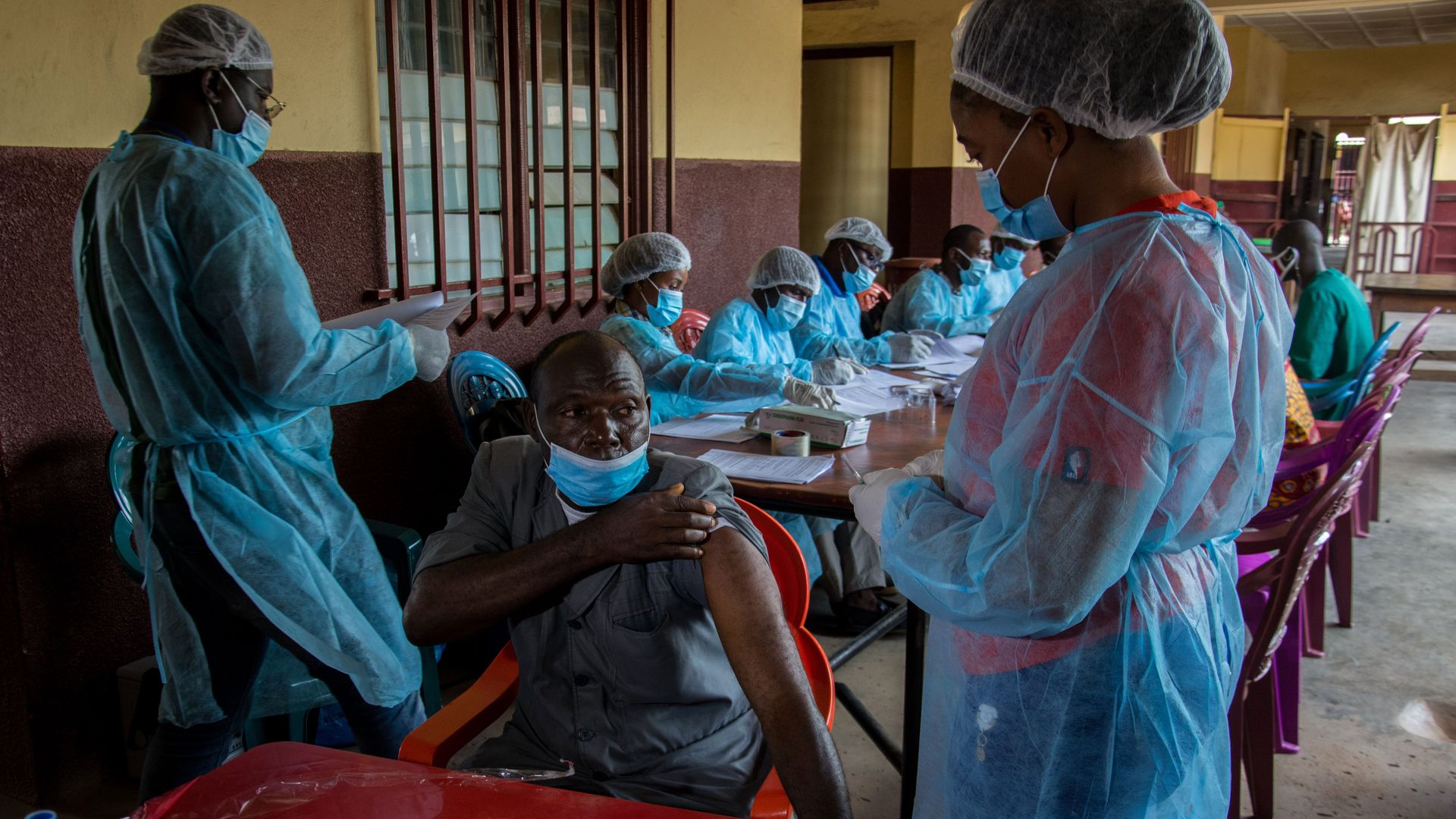 A health worker administering an anti-Ebola vaccination in N'zerekore, Guinea, on Feb. 24.