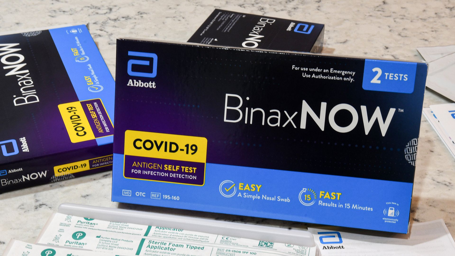 A BinaxNOW rapid COVID test box on a counter.