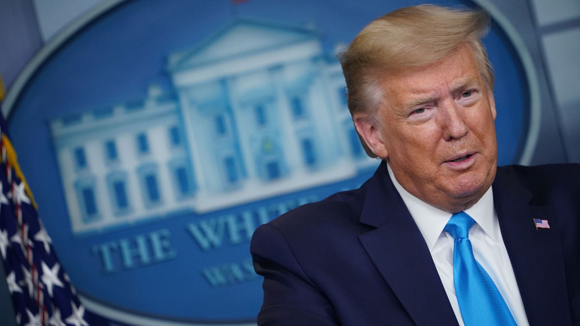 In this image, Trump briefs reporters in the White House