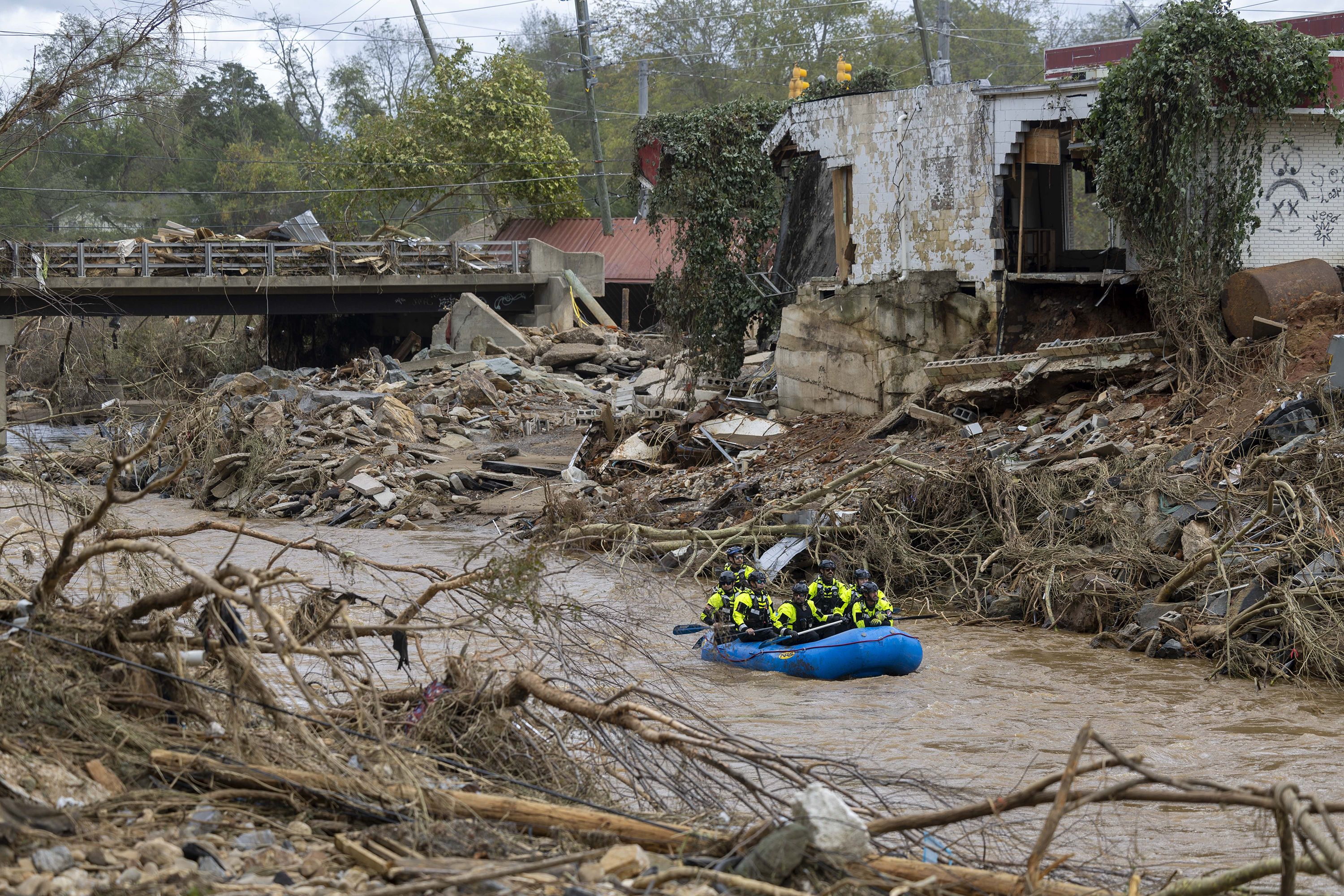 A rescue team paddles down the Swannanoa River on Sunday, Sept. 29, 2024.