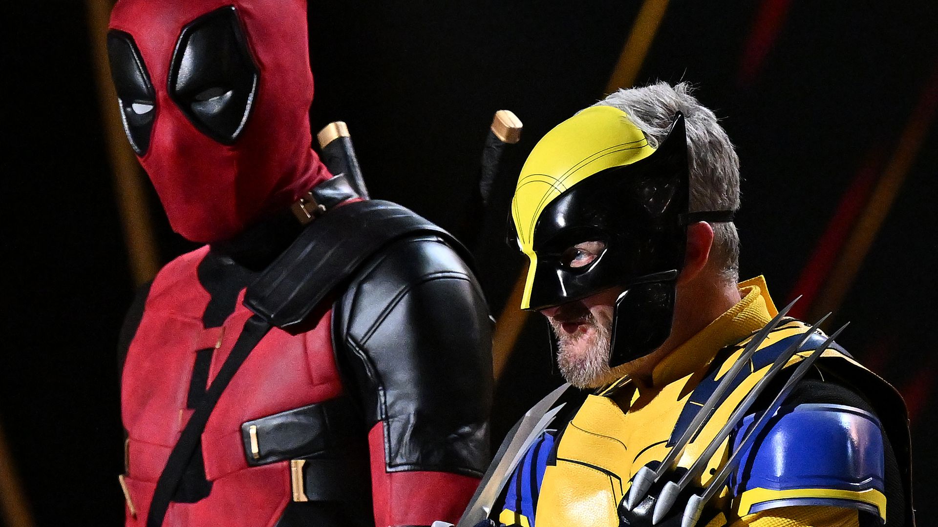 Andy Lee, left, and Stephen Curry dressed as Deadpool and Wolverine.