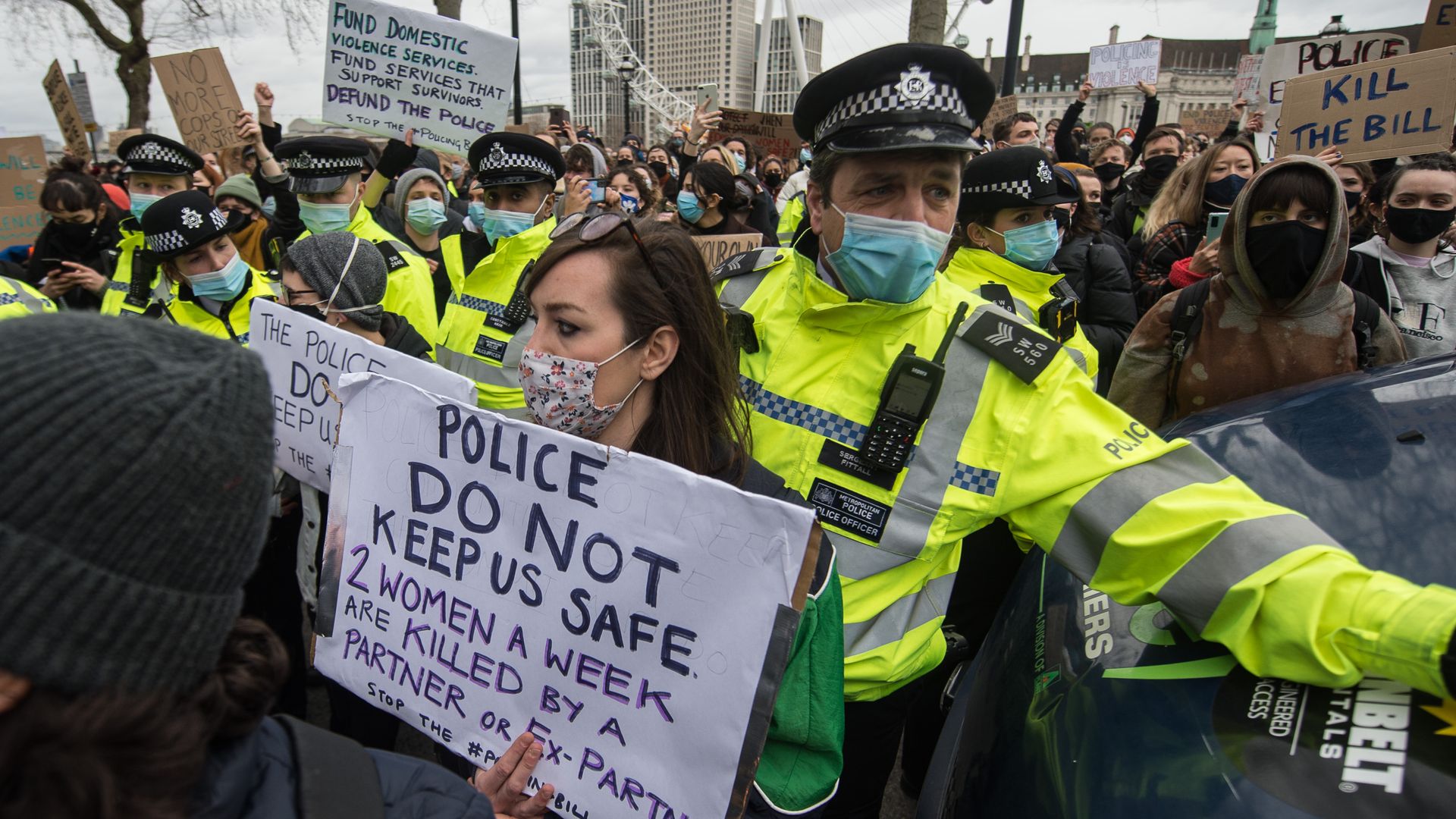 Protestors demonstrate outside Scotland Yard over the treatment of people by police at a March vigil for Sarah Everard  in London, England. 