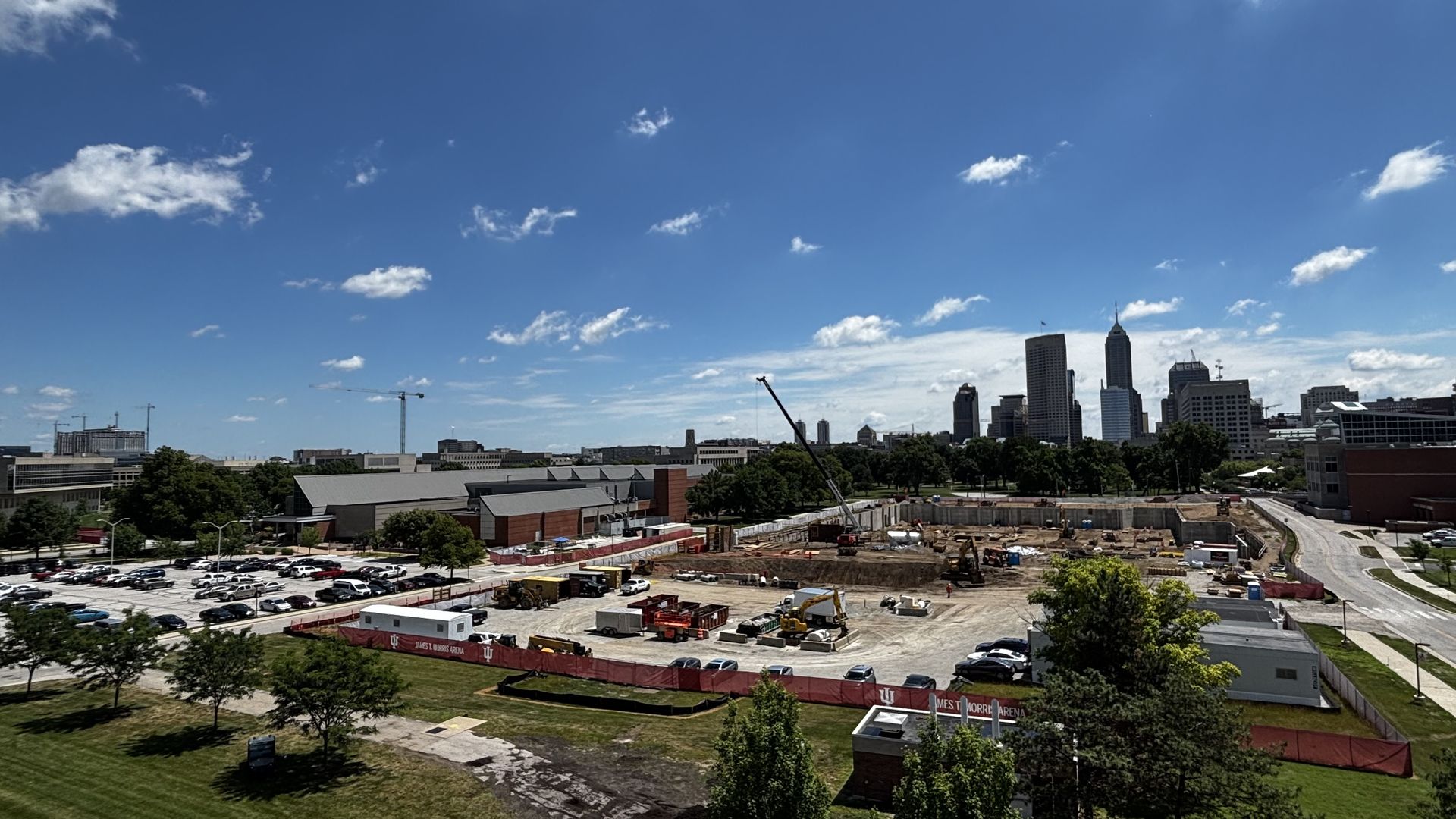 A construction site with a skyline in the background