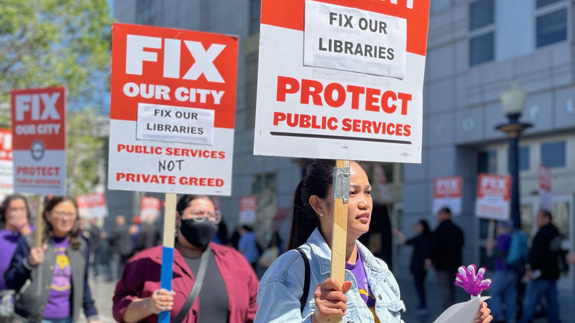 people holding signs