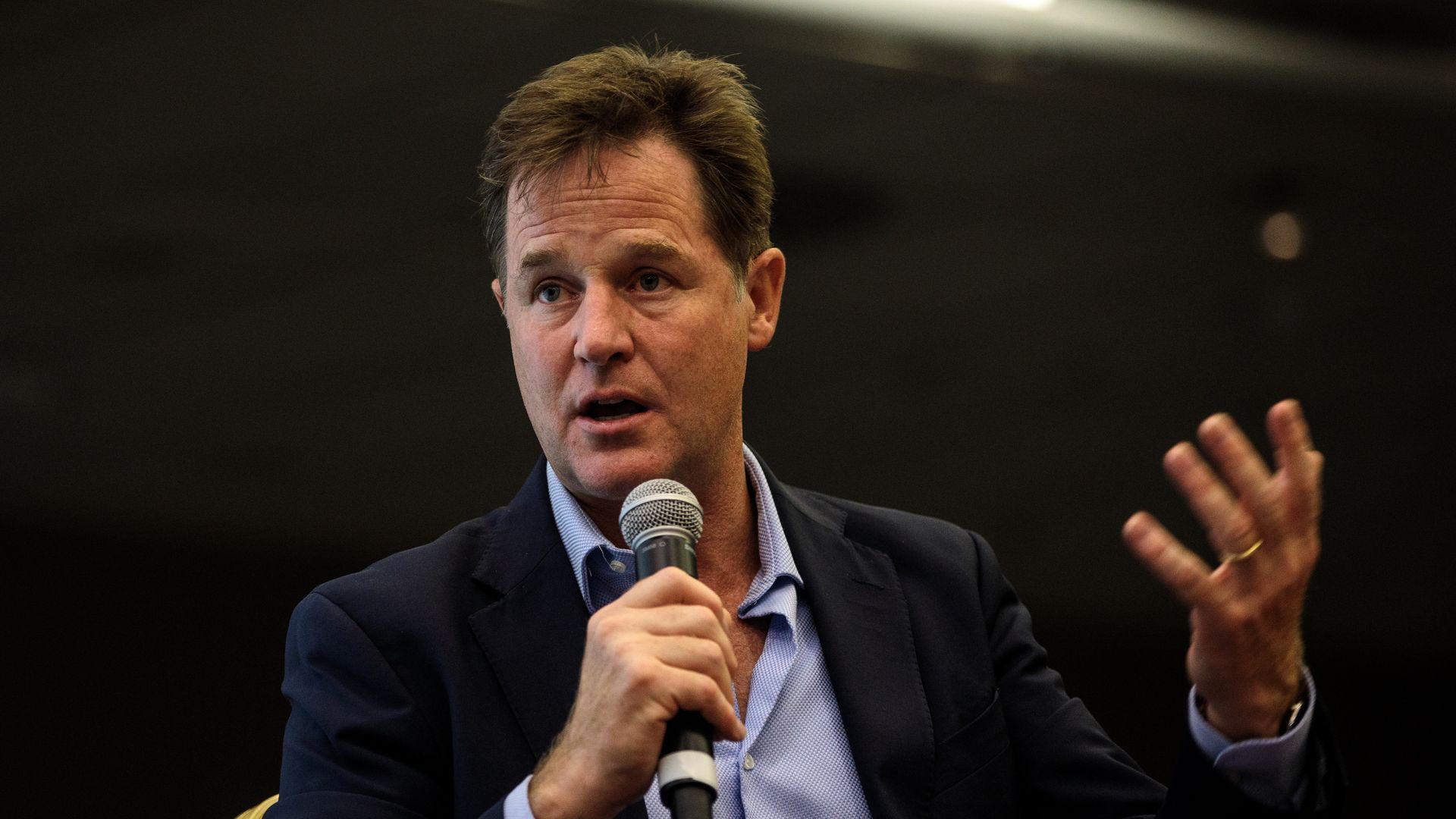 A man holds a microphone