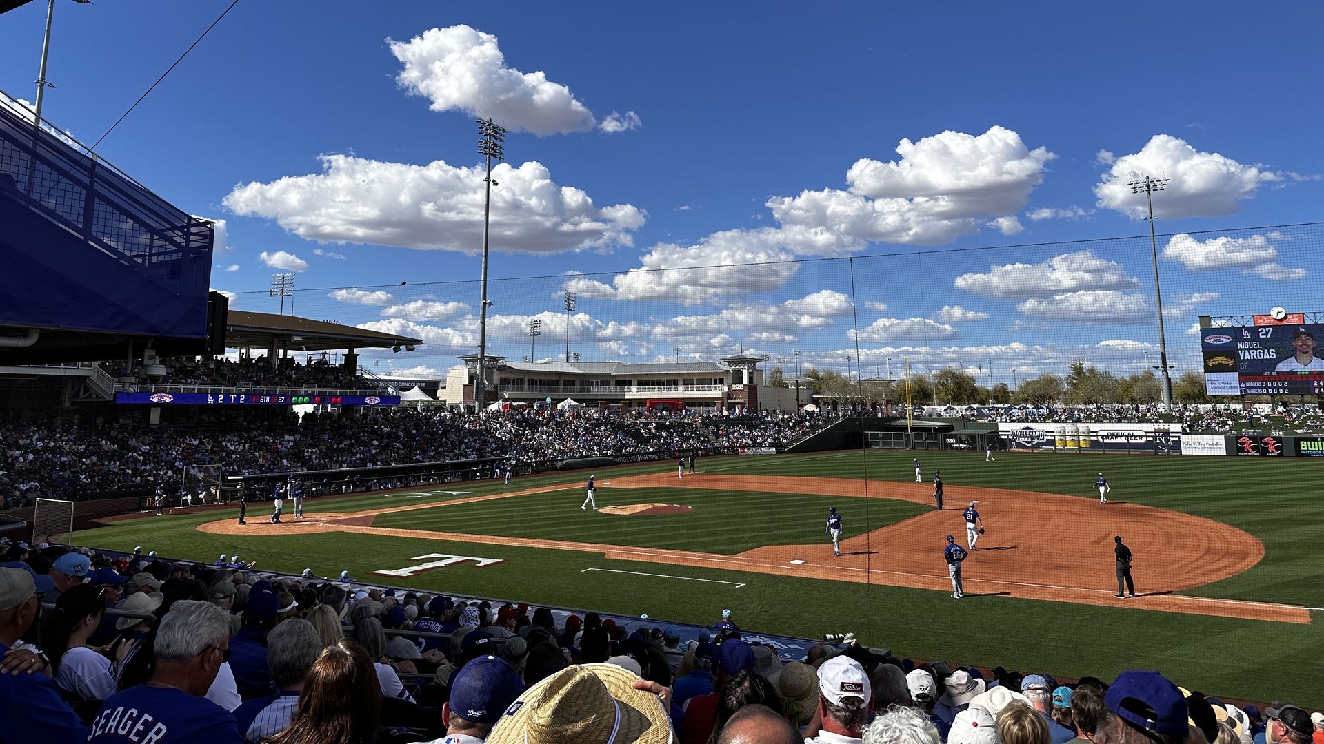 A baseball field with the Rangers "T" along the edge of the field