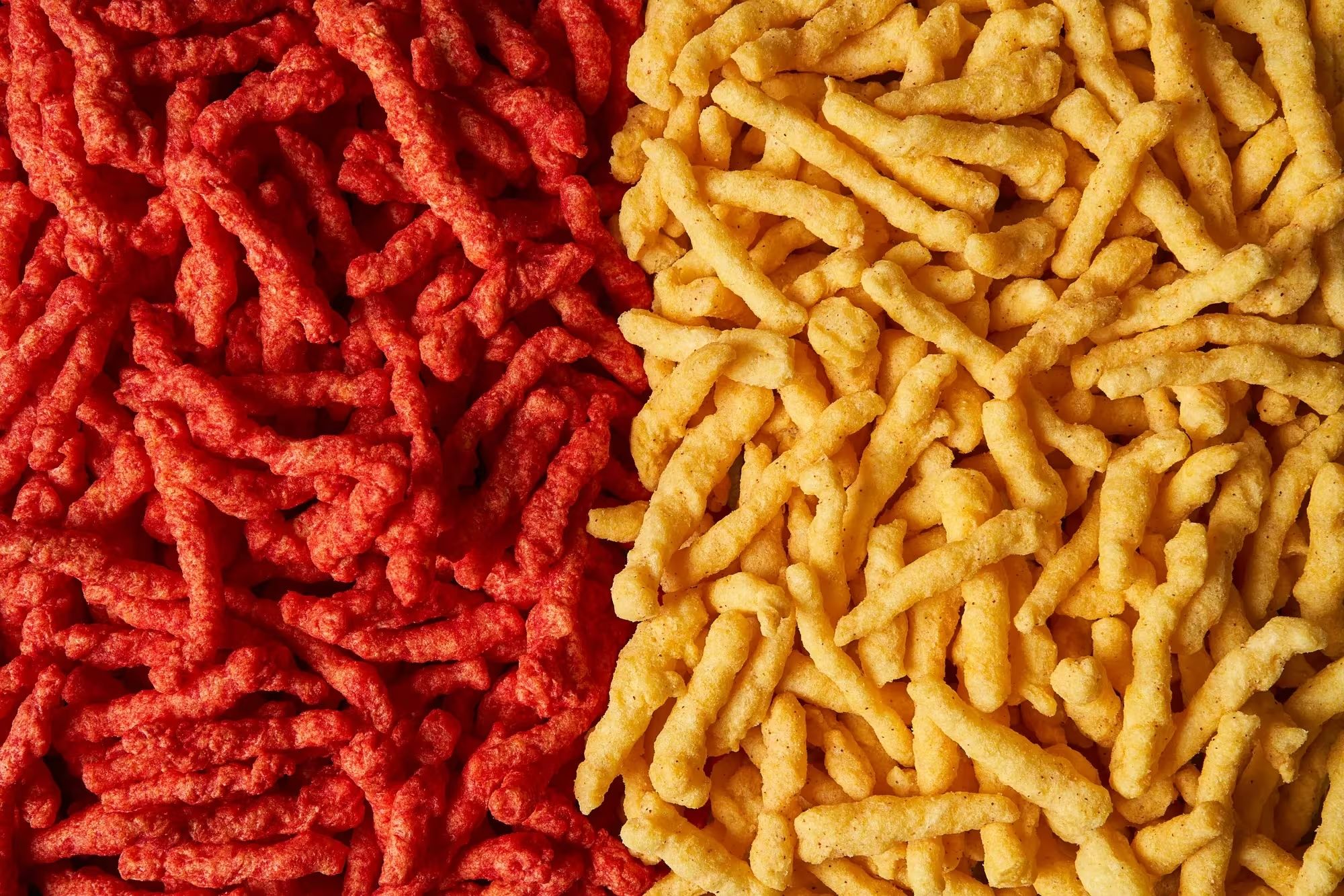 Flamin' Hot Cheetos (left) compared with the new Cheetos Simply NKD Flamin' Hot Cheetos, which doesn't have artificial coloring. 