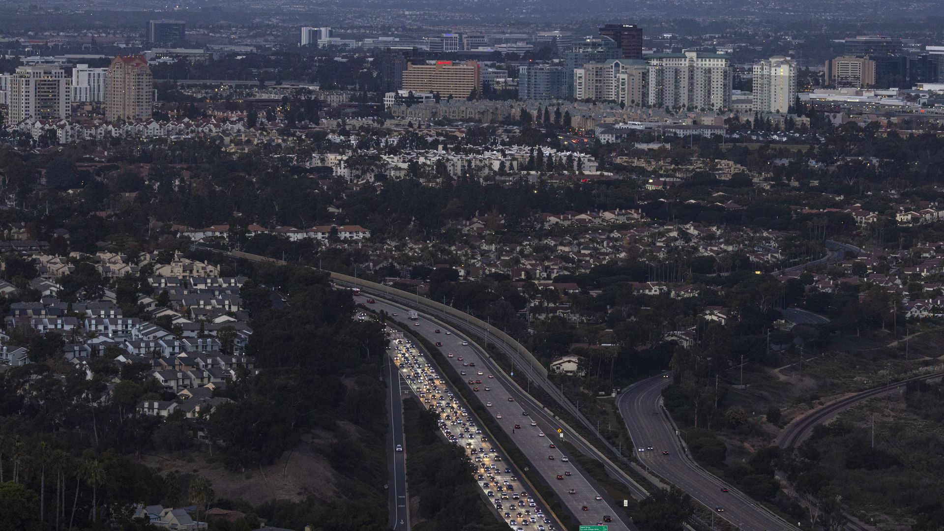 SAN DIEGO, CALIFORNIA - NOVEMBER 15: Traffic backs up during the afternoon commute on Interstate 5 as the sun sets on November 15, 2023 in San Diego, California. (Photo by Kevin Carter/Getty Images)
