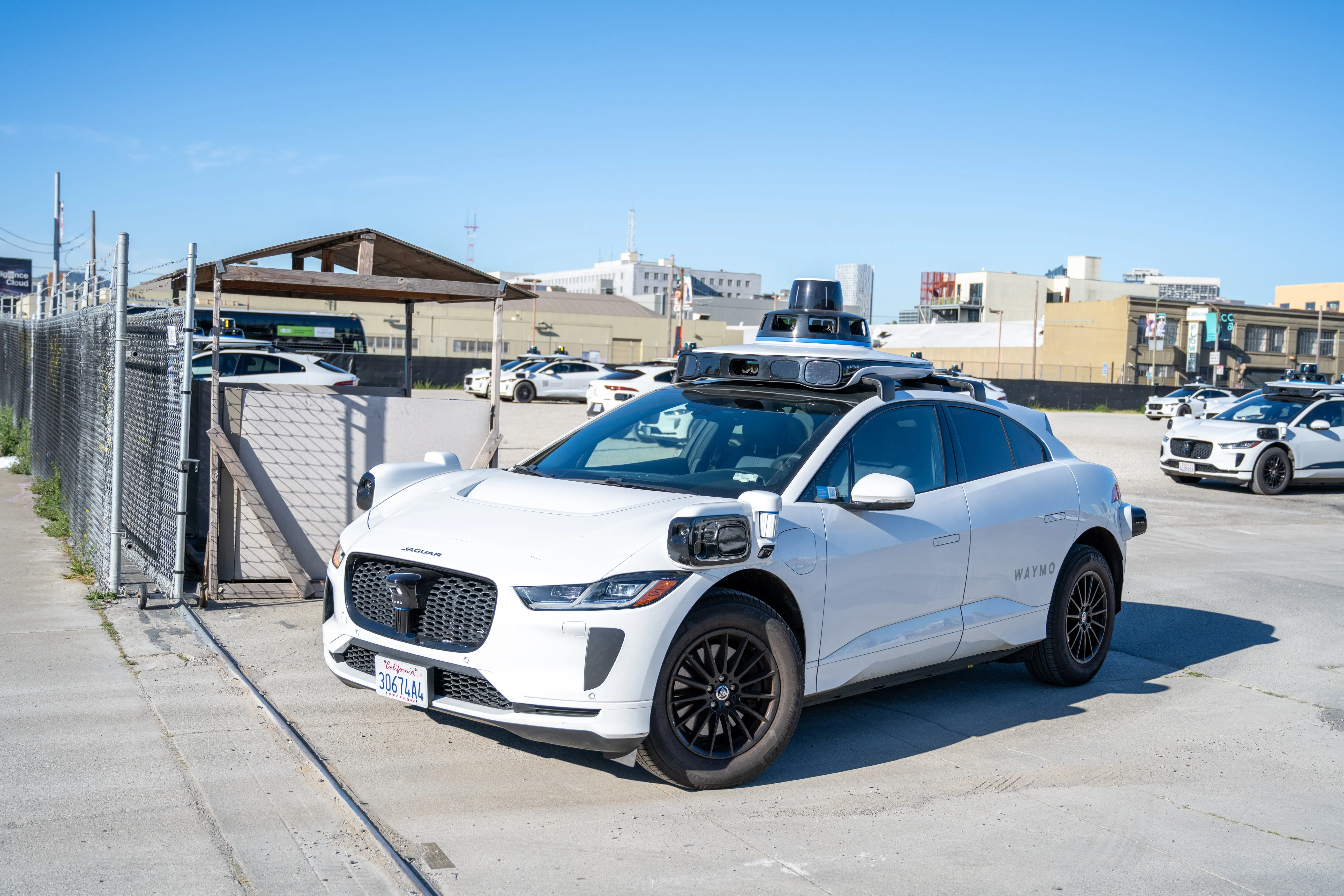 Waymo vehicles at a staging facility in San Francisco.