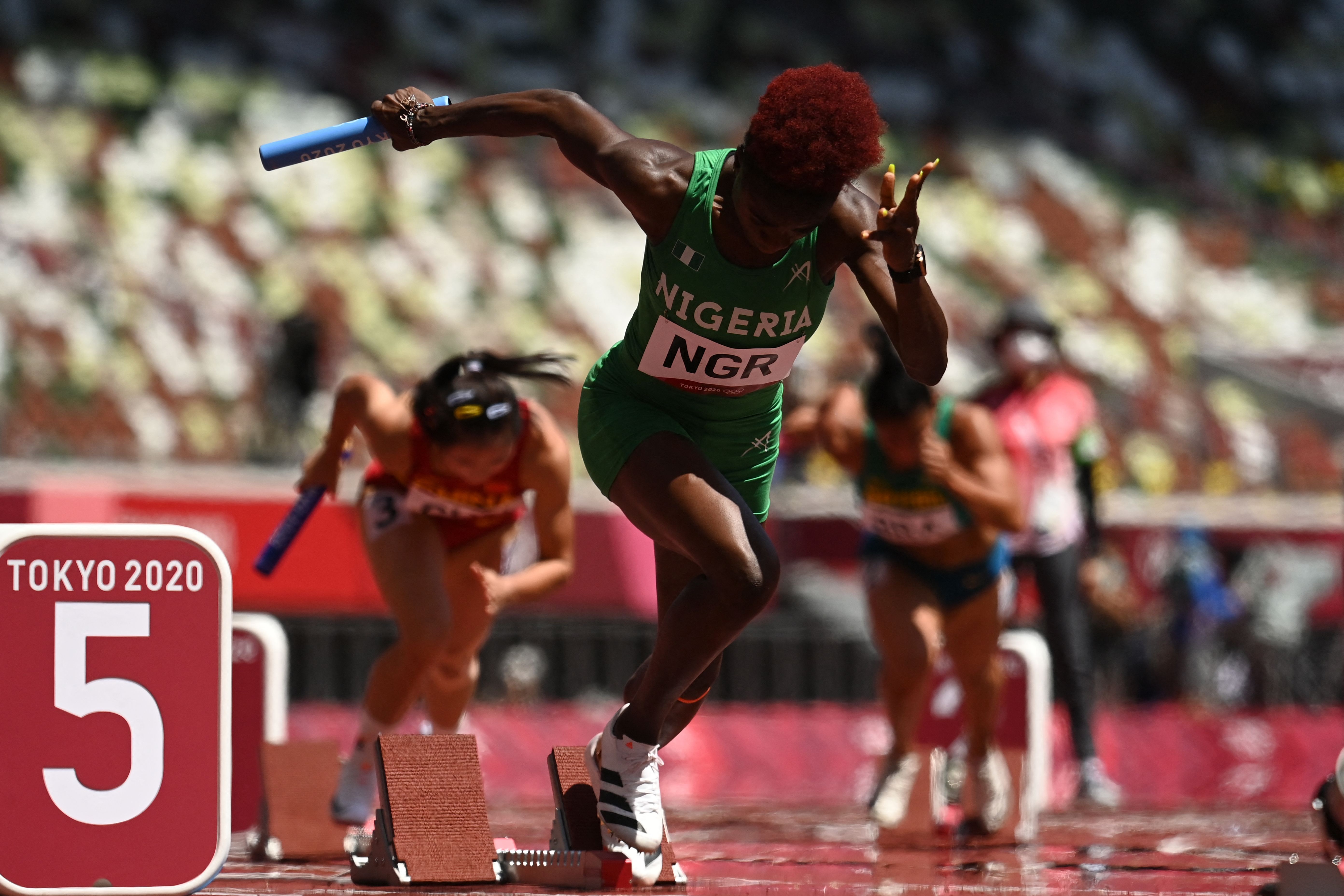  Nigeria's Tobi Amusan competes in the women's 4x100m relay heats during the Tokyo 2020 Olympic Games at the Olympic Stadium in Tokyo on August 5
