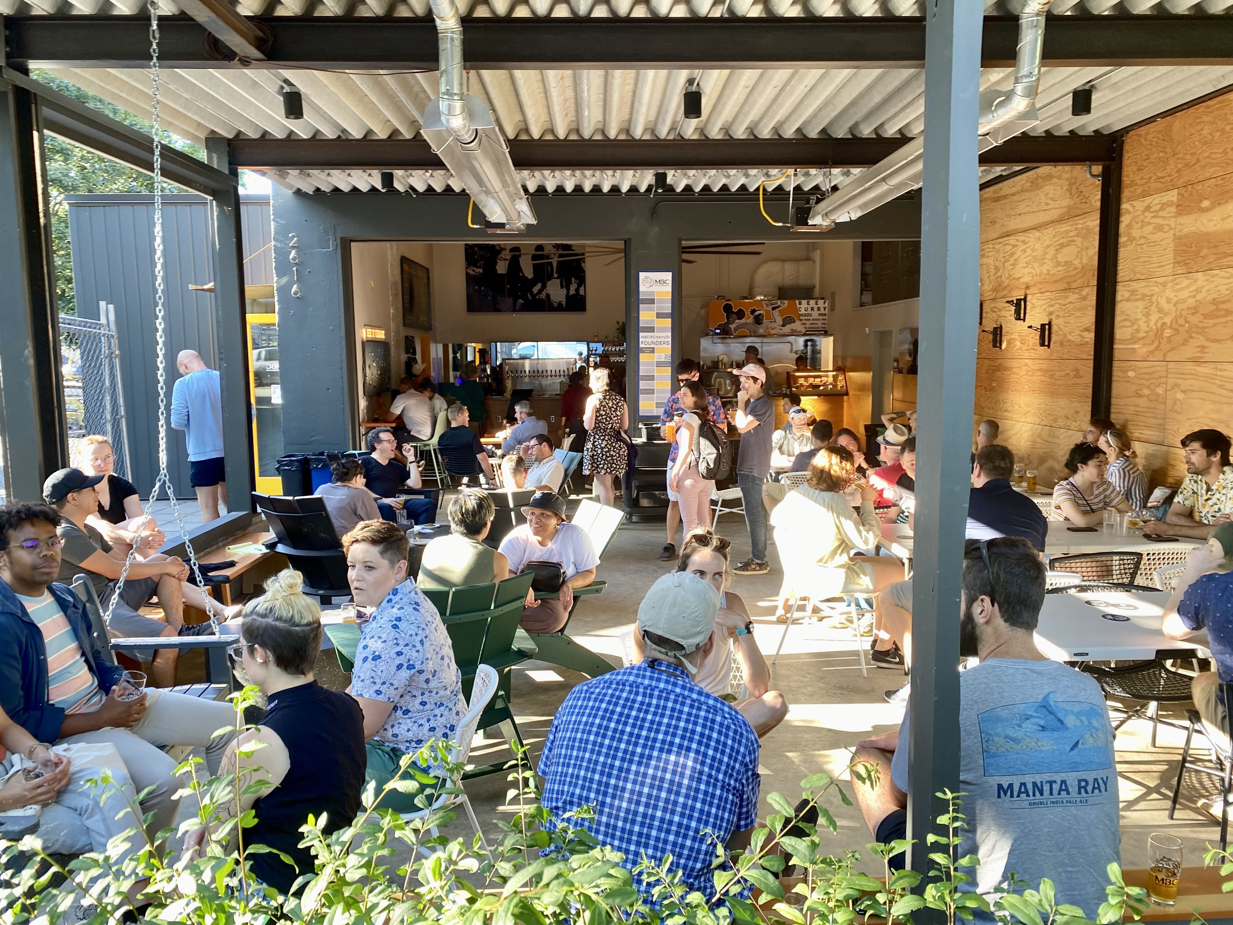 A view of the open seating at Metier Brewing Company in the Central District.