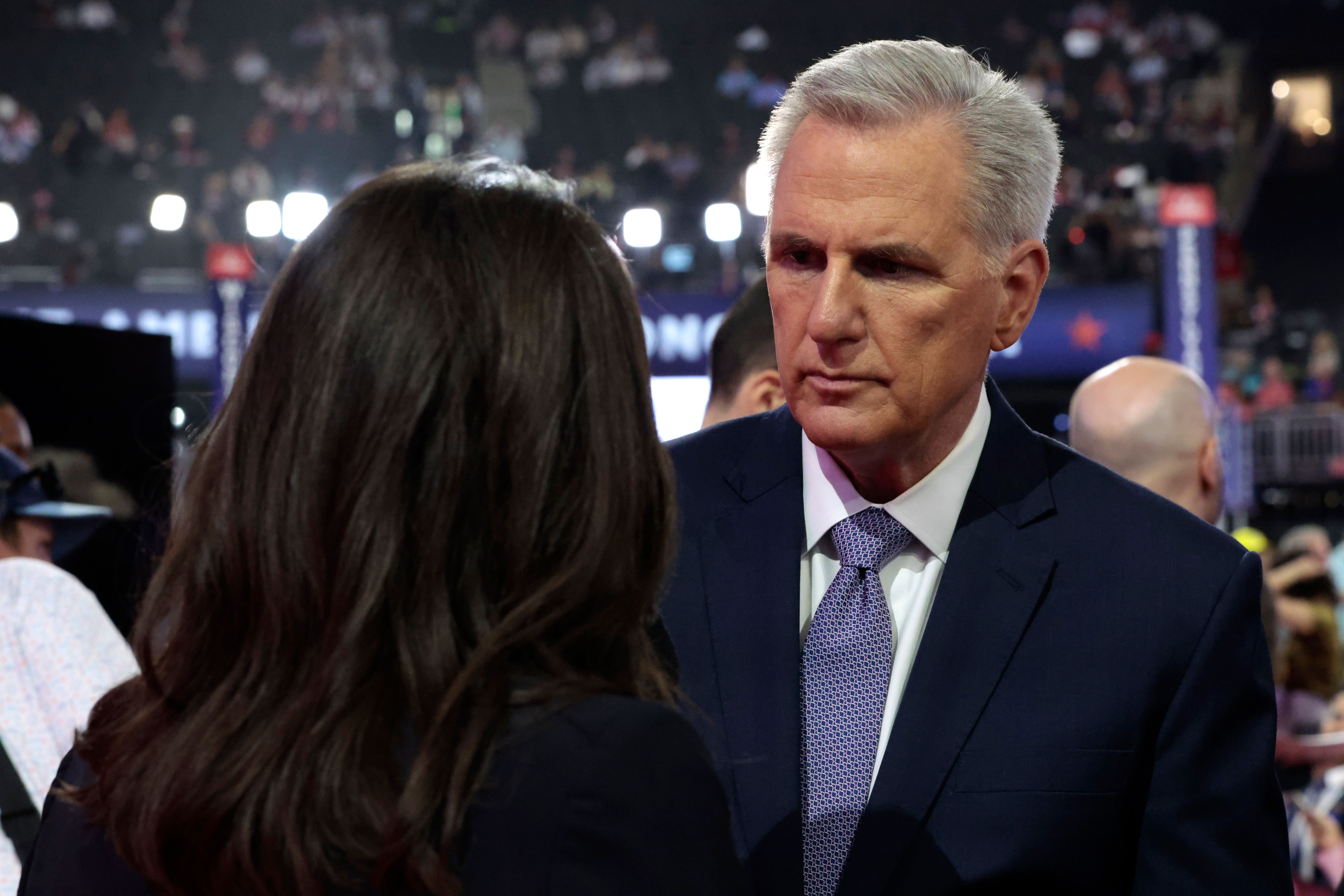 Former Speaker Kevin McCarthy speaks to a reporter at the RNC in July.