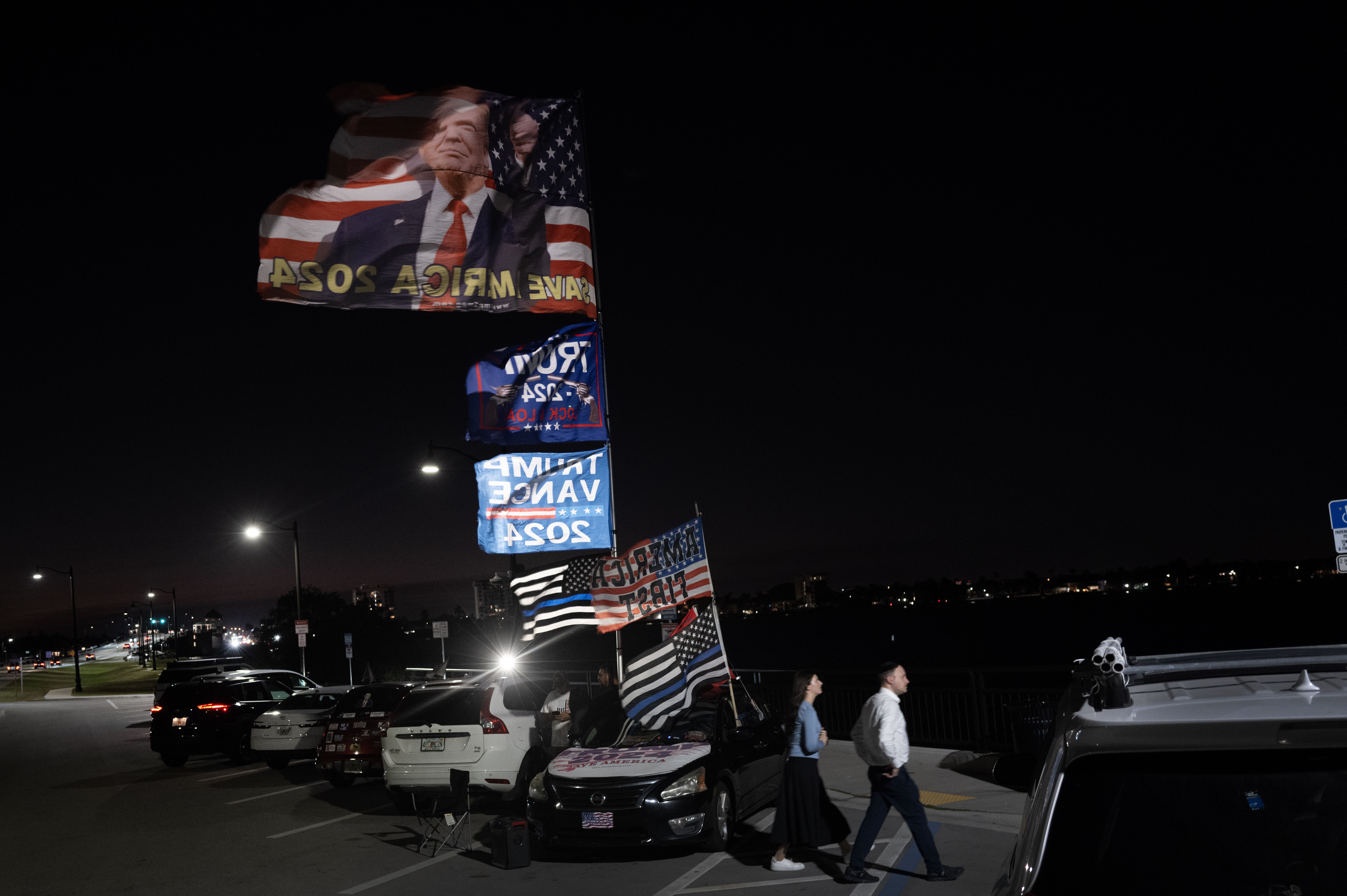 Supporters of Trump wave flags outside Mar-a-Lago
