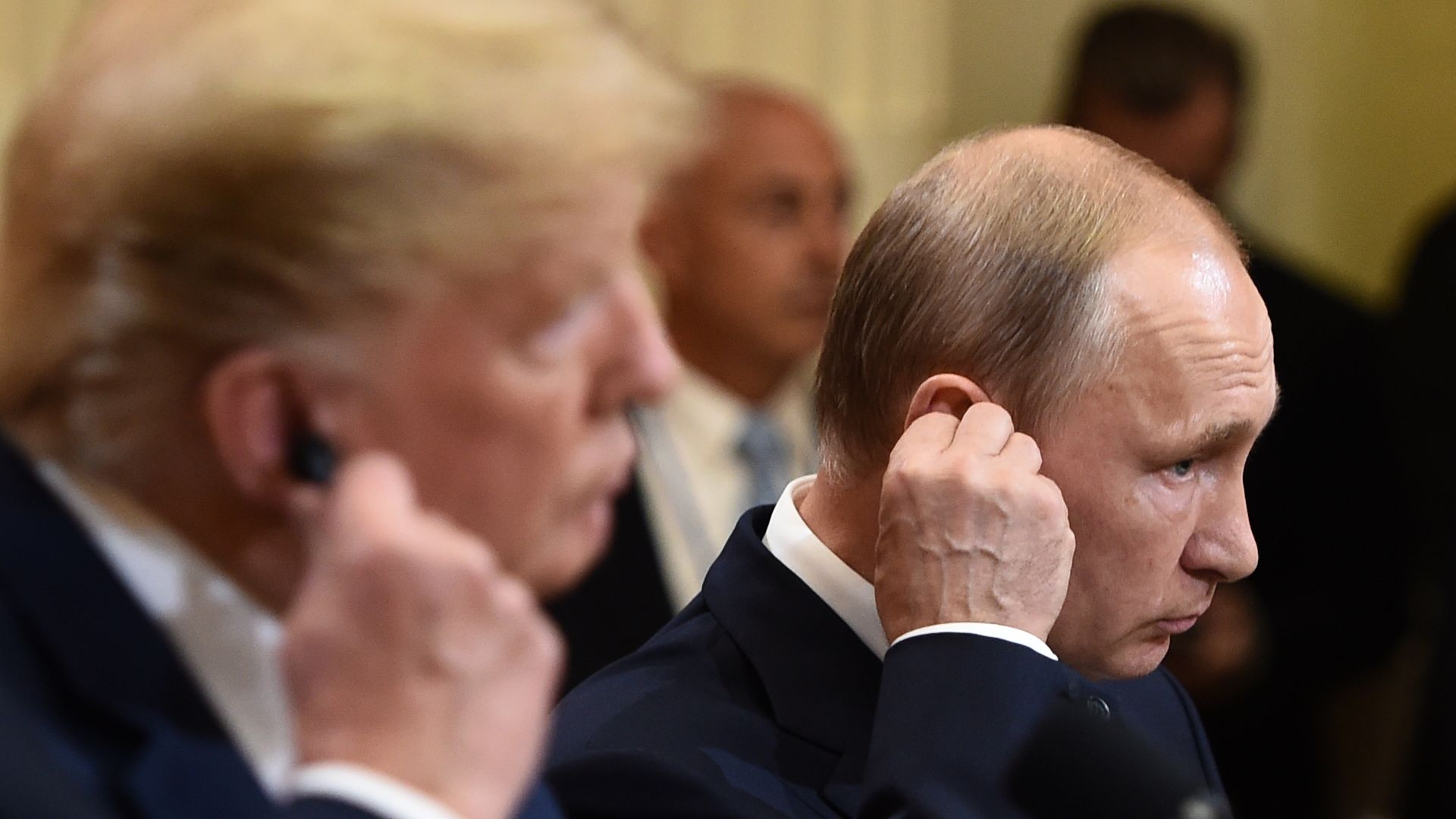 President Donald Trump and Russia's President Vladimir sitting next to each other at a press conference