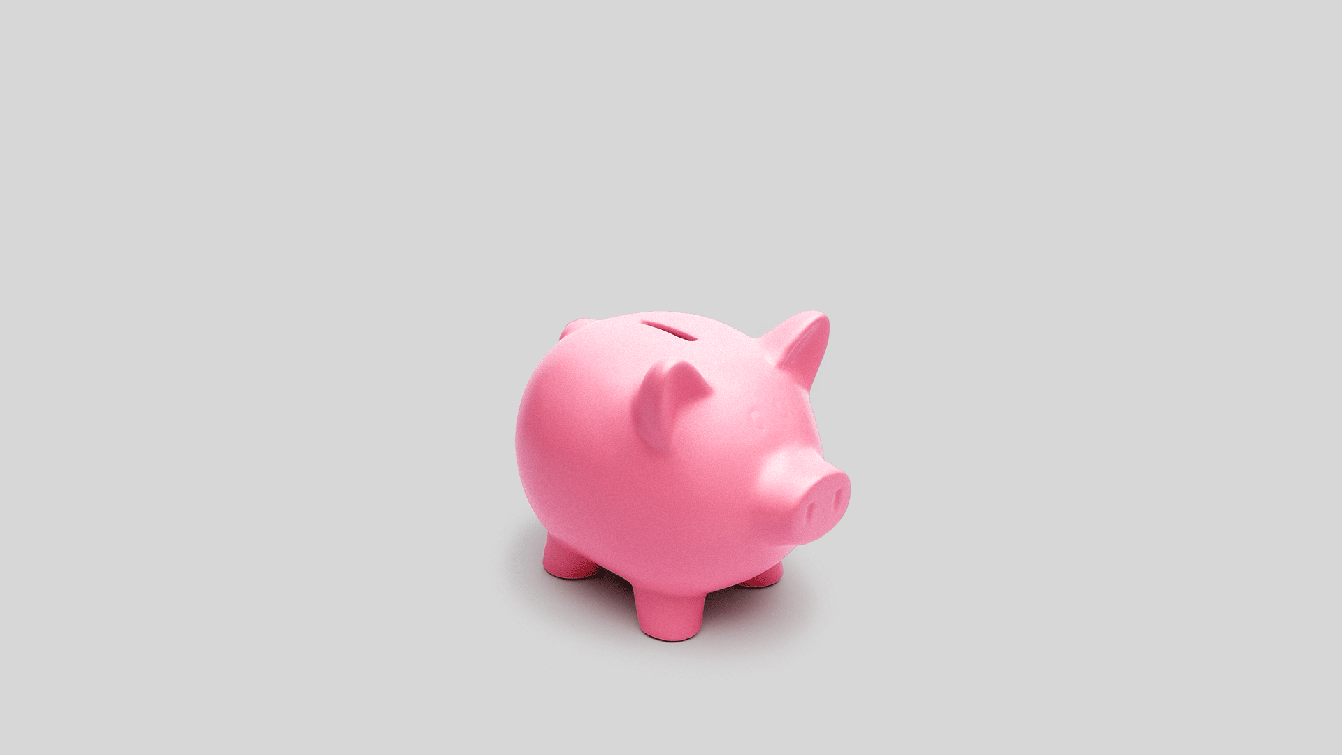 A GIF of a Piggy Bank that has a thought bubble with money signs coming out of it.