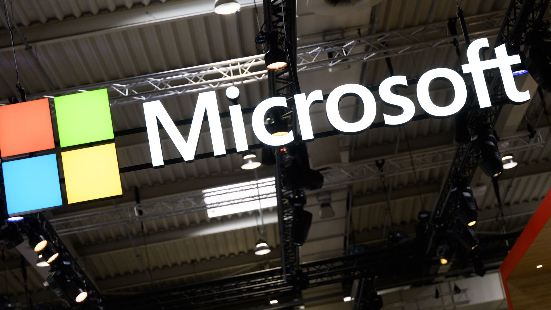 A logo hangs on the Microsoft stand at Hannover Messe 2024.