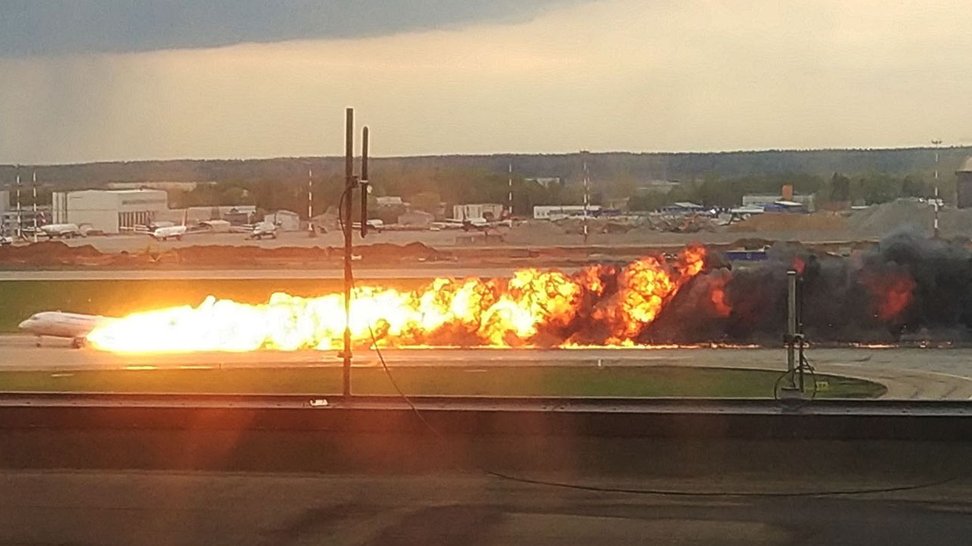 A passenger plane is seen on fire during its emergency landing in Sheremetyevo International Airport in Moscow, Russia.