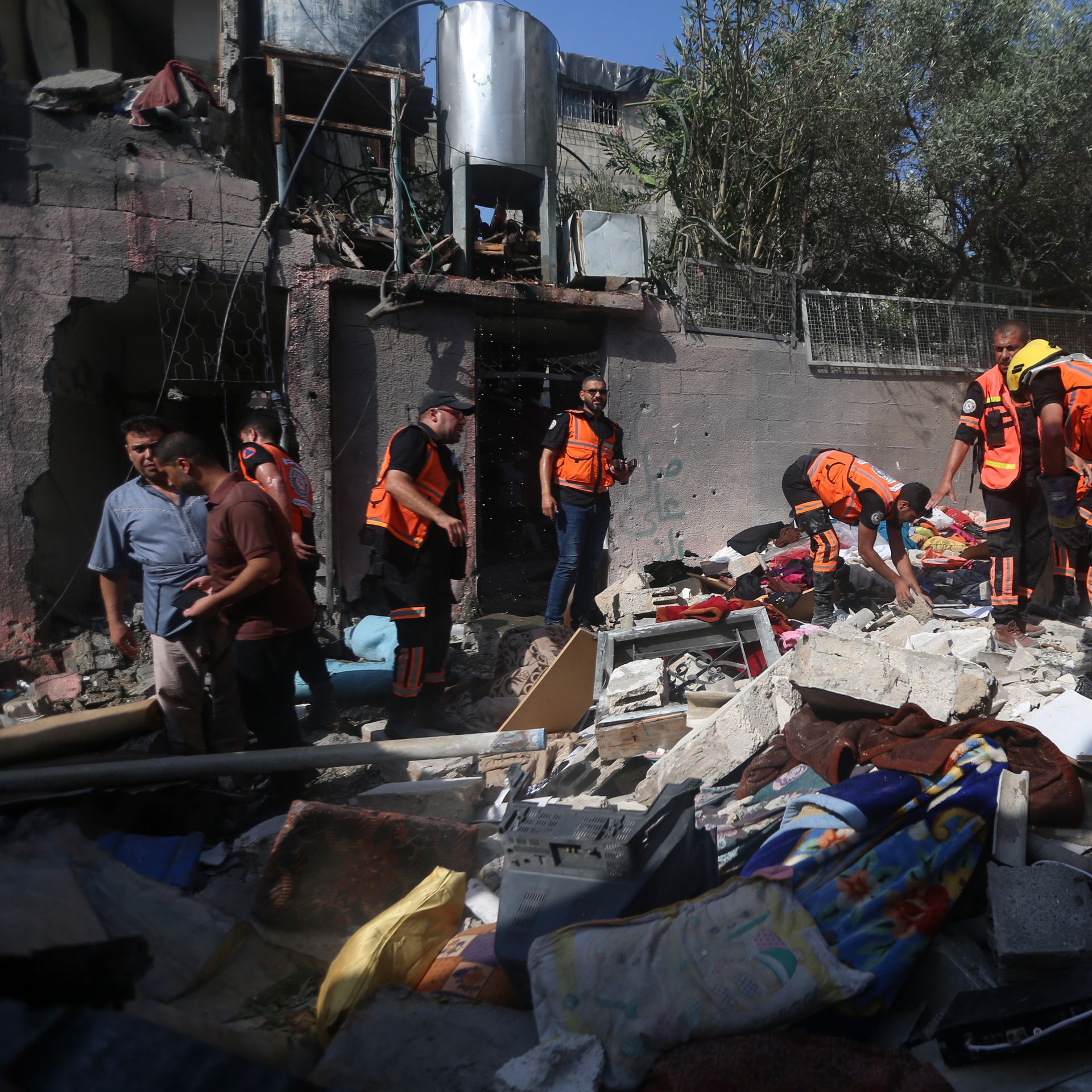 Civil defense teams inspect damage after an Israeli airstrike on the Jabalia refugee camp, north of Gaza City, Gaza on August 7.