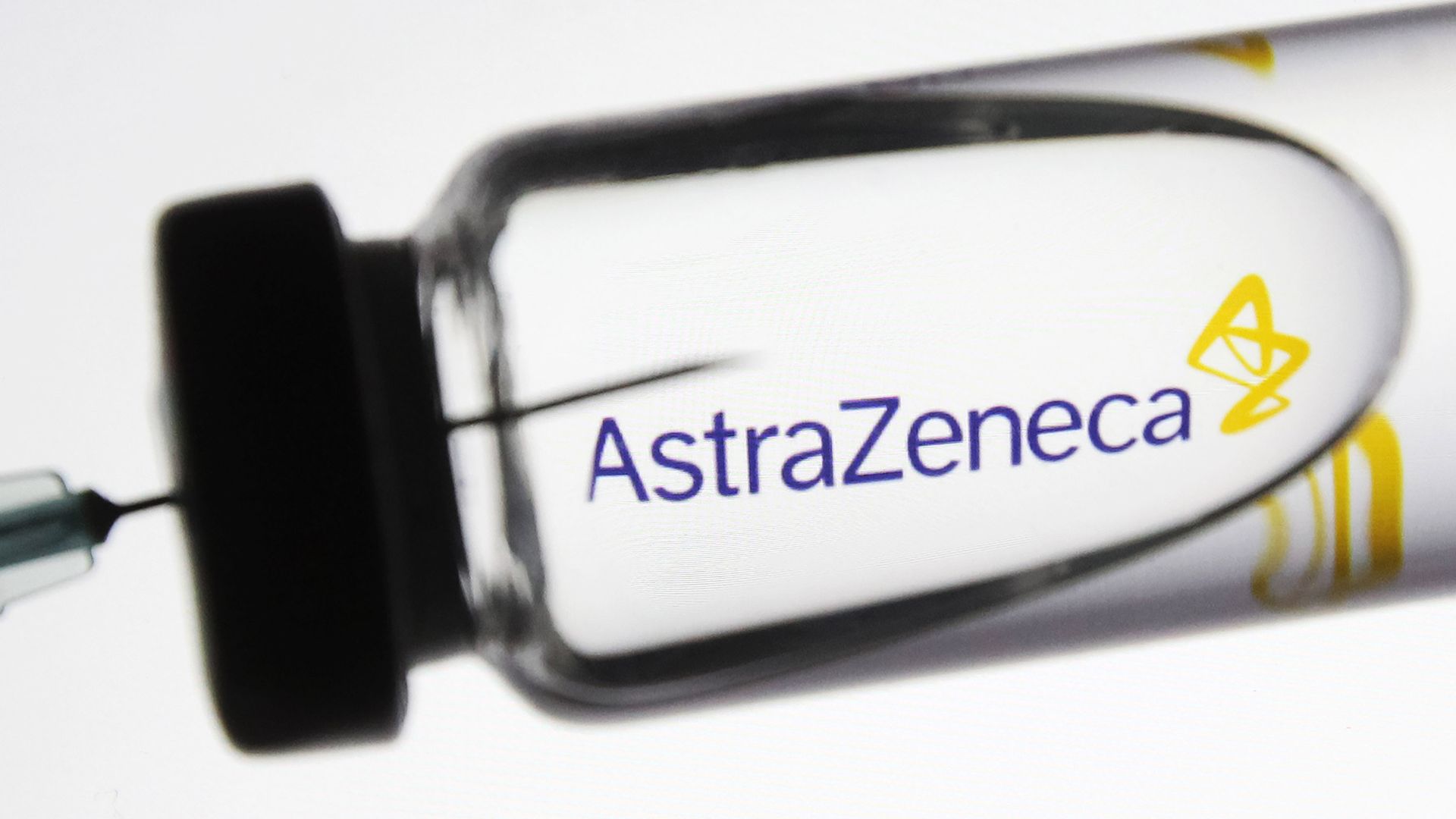 Close-up shot of a vial with the AstraZeneca label on it 