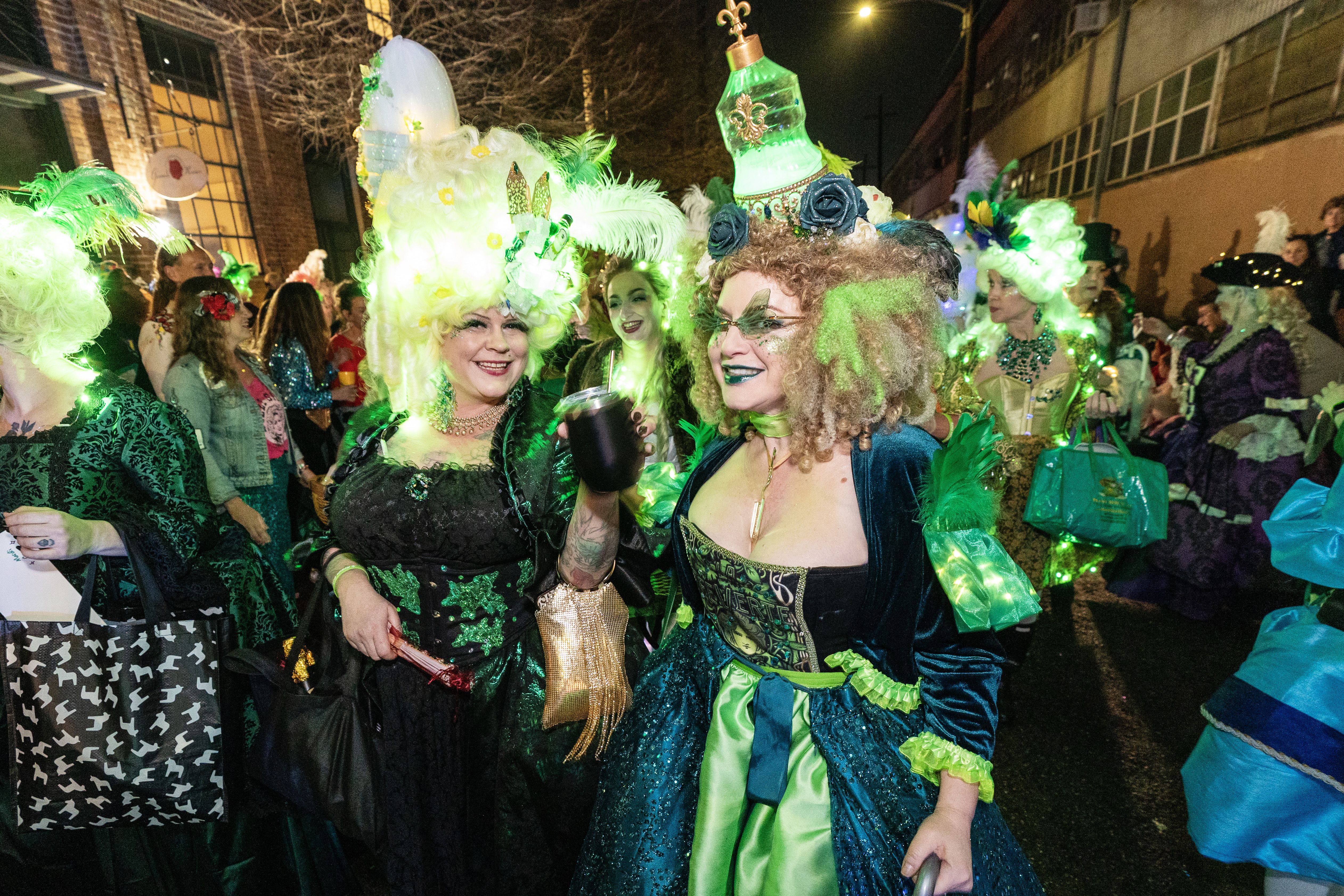 Photo shows the Merry Antoinettes with glowing green wigs