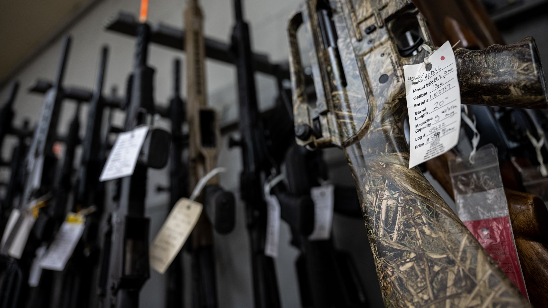 Photo of AR-15 rifles hanging on display at a store