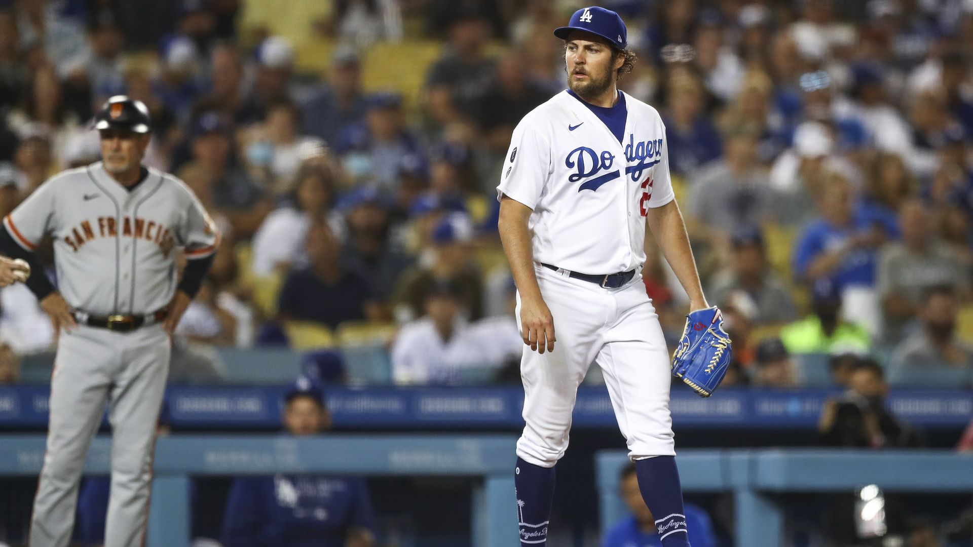 Trevor Bauer #27 of the Los Angeles Dodgers looks on during the sixth inning against the San Francisco Giants at Dodger Stadium on June 28, 2021 in Los Angeles, California. 