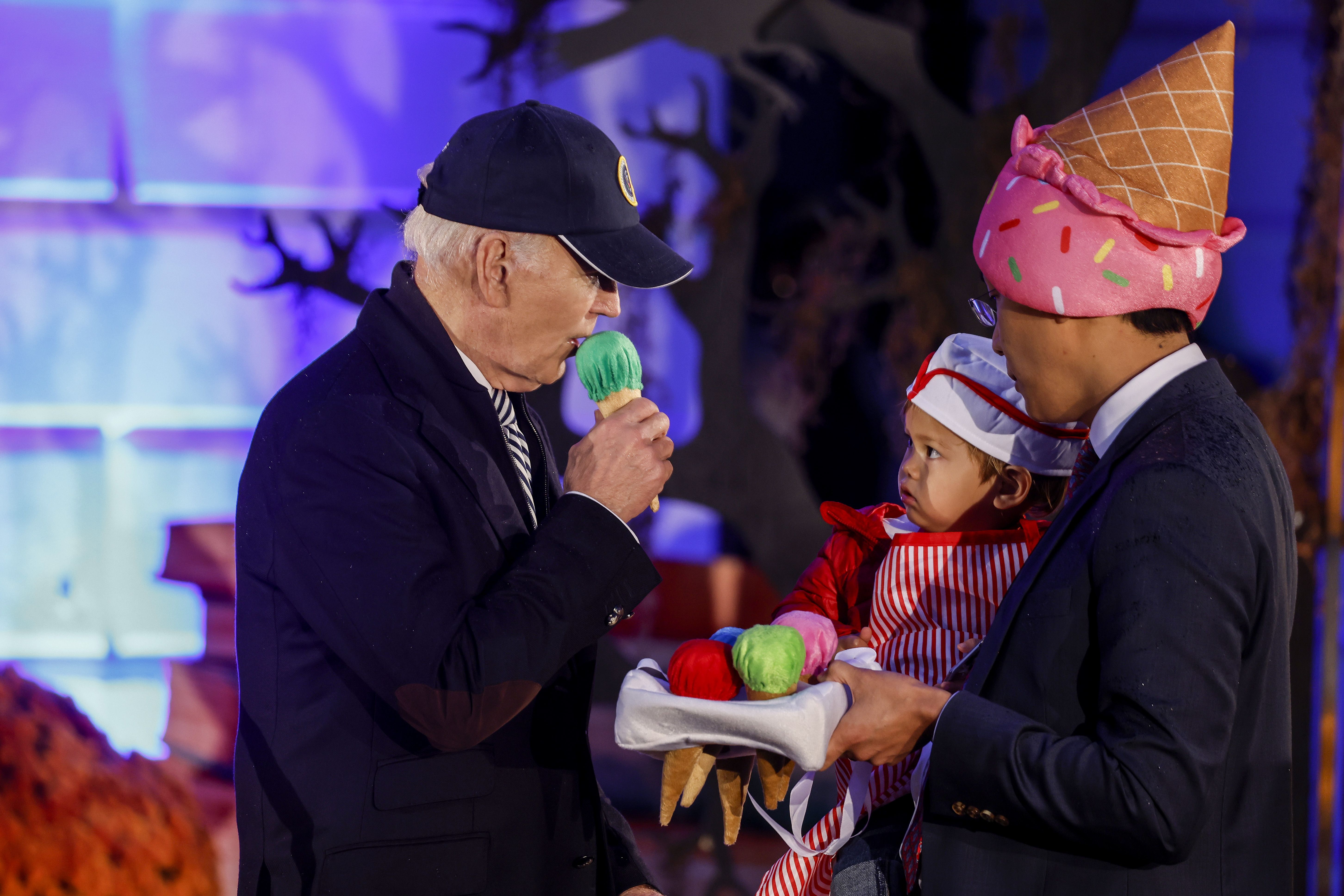 Joe Biden hands out boxes of chocolates during a Halloween trick-or-treat event on the South Lawn of the White House on October 30