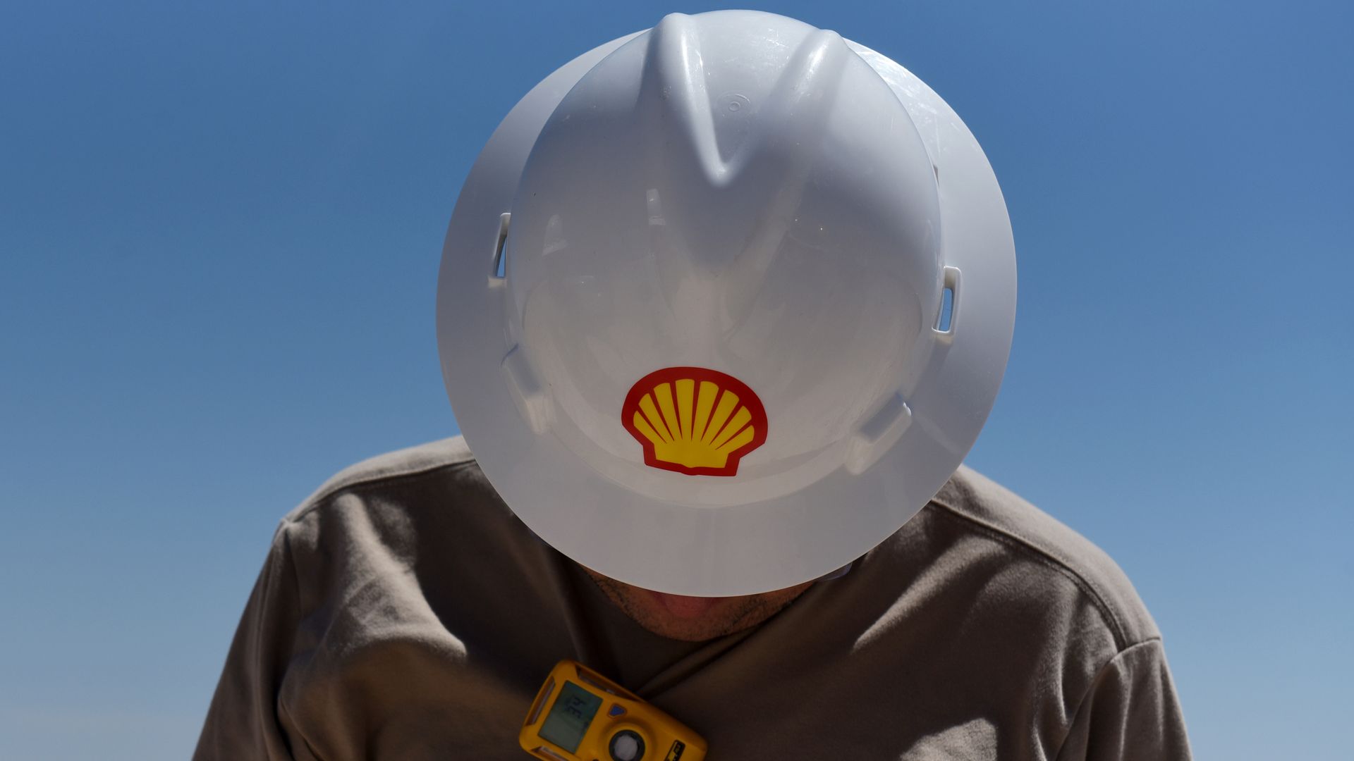 A logo is displayed on the hardhat of a worker at the Royal Dutch Shell processing facility in Loving, Texas, in 2018.