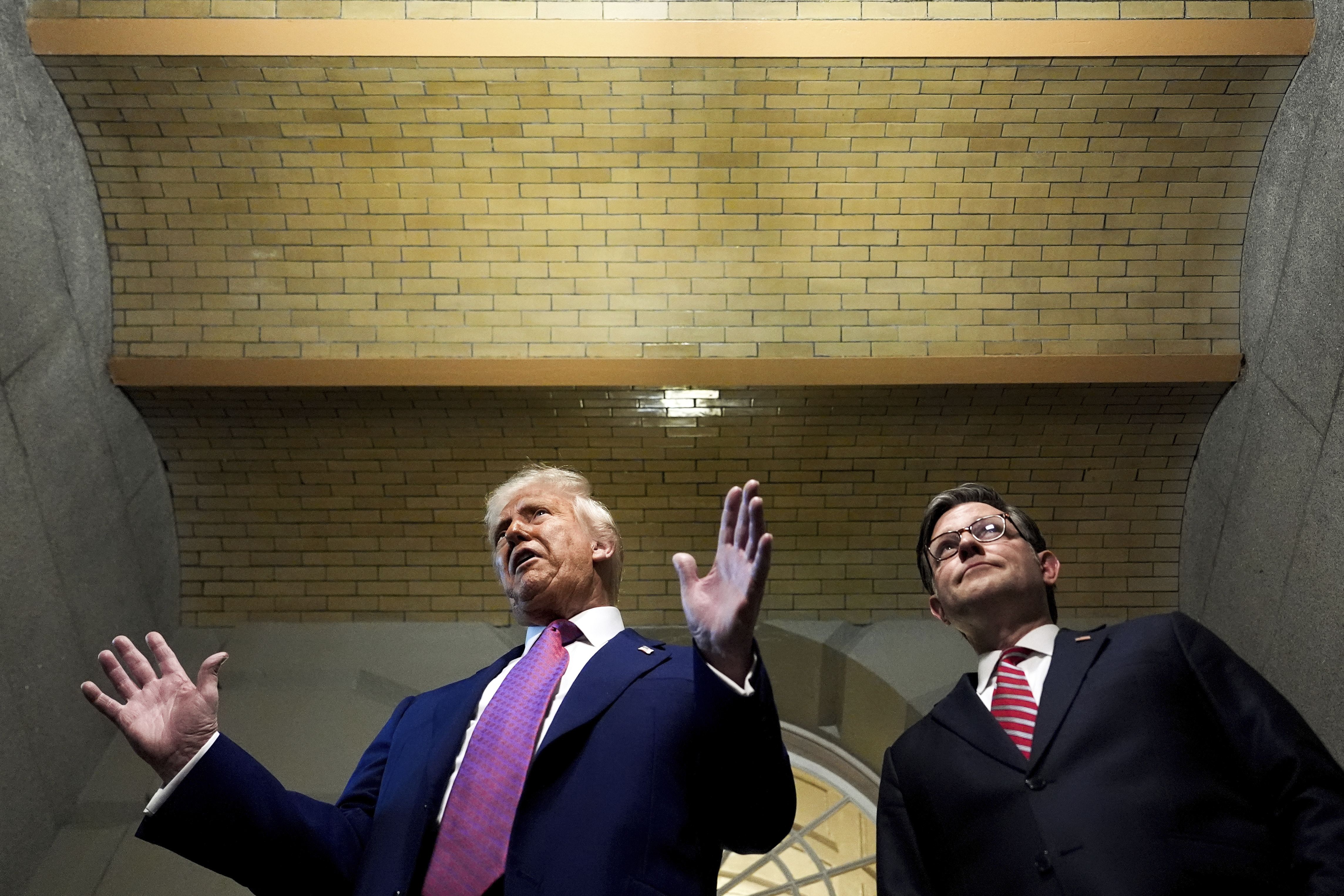 President Donald Trump and Speaker of the House Mike Johnson, R-La., speak to reporters after departing a House Republican conference meeting, Tuesday, May 20, 2025, at the U.S. Capitol in Washington
