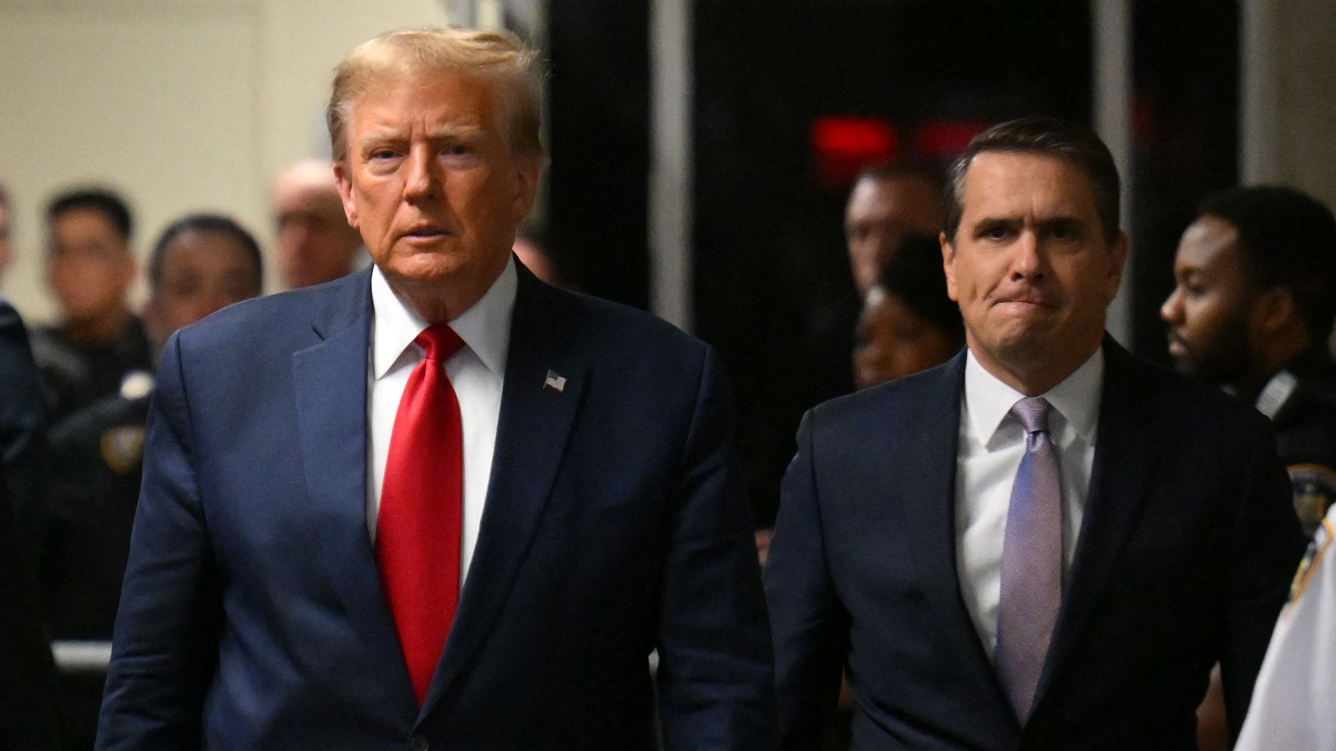 Former US President Donald Trump, with his lawyer Todd Blanche (R), arrives at Manhattan Criminal Court for a hearing in his case of paying hush money to cover up extramarital affairs in New York City on February 15, 2024. 
