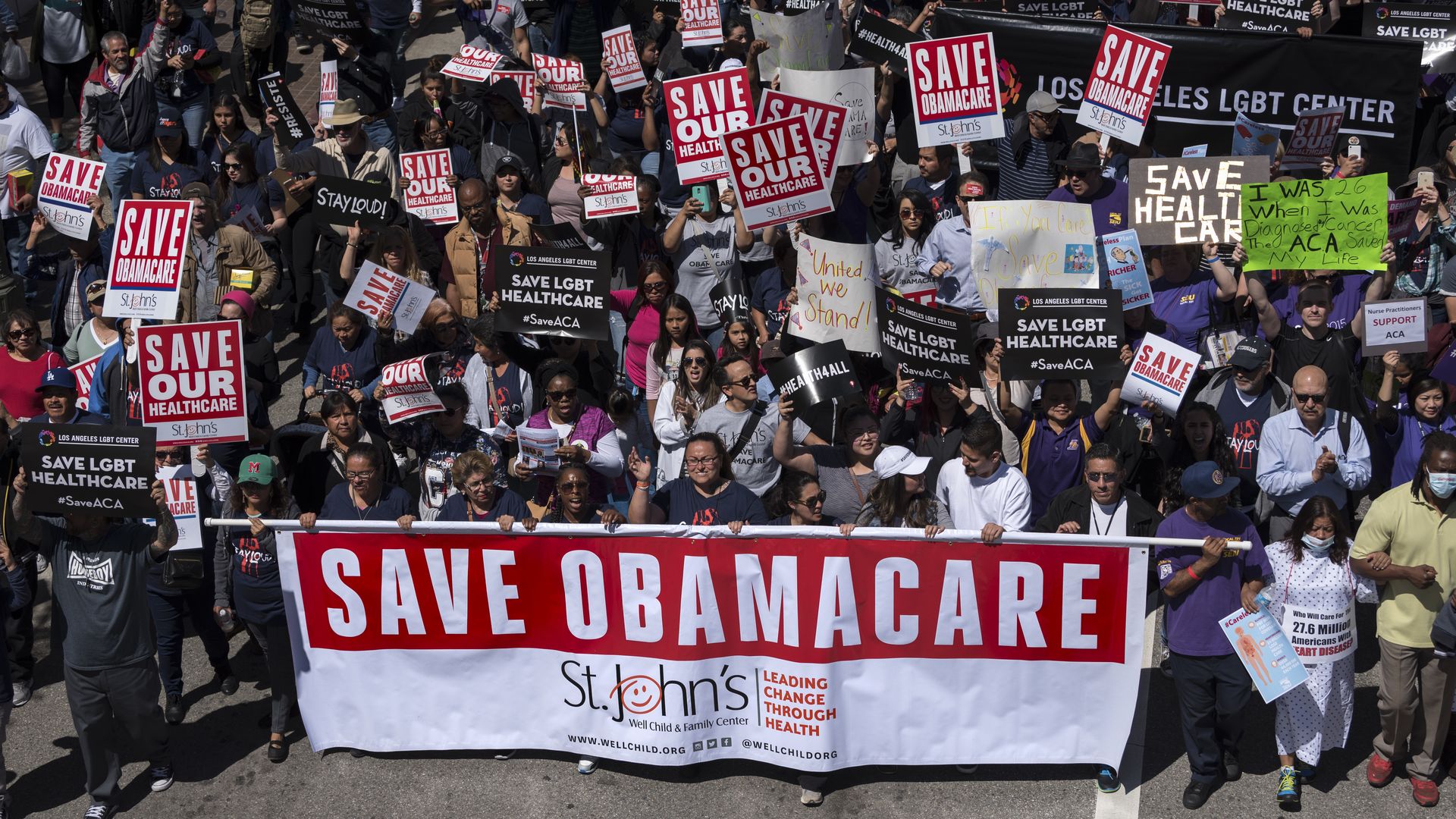 Big Affordable Care Act rally in Los Angeles, with a "Save Obamacare" sign