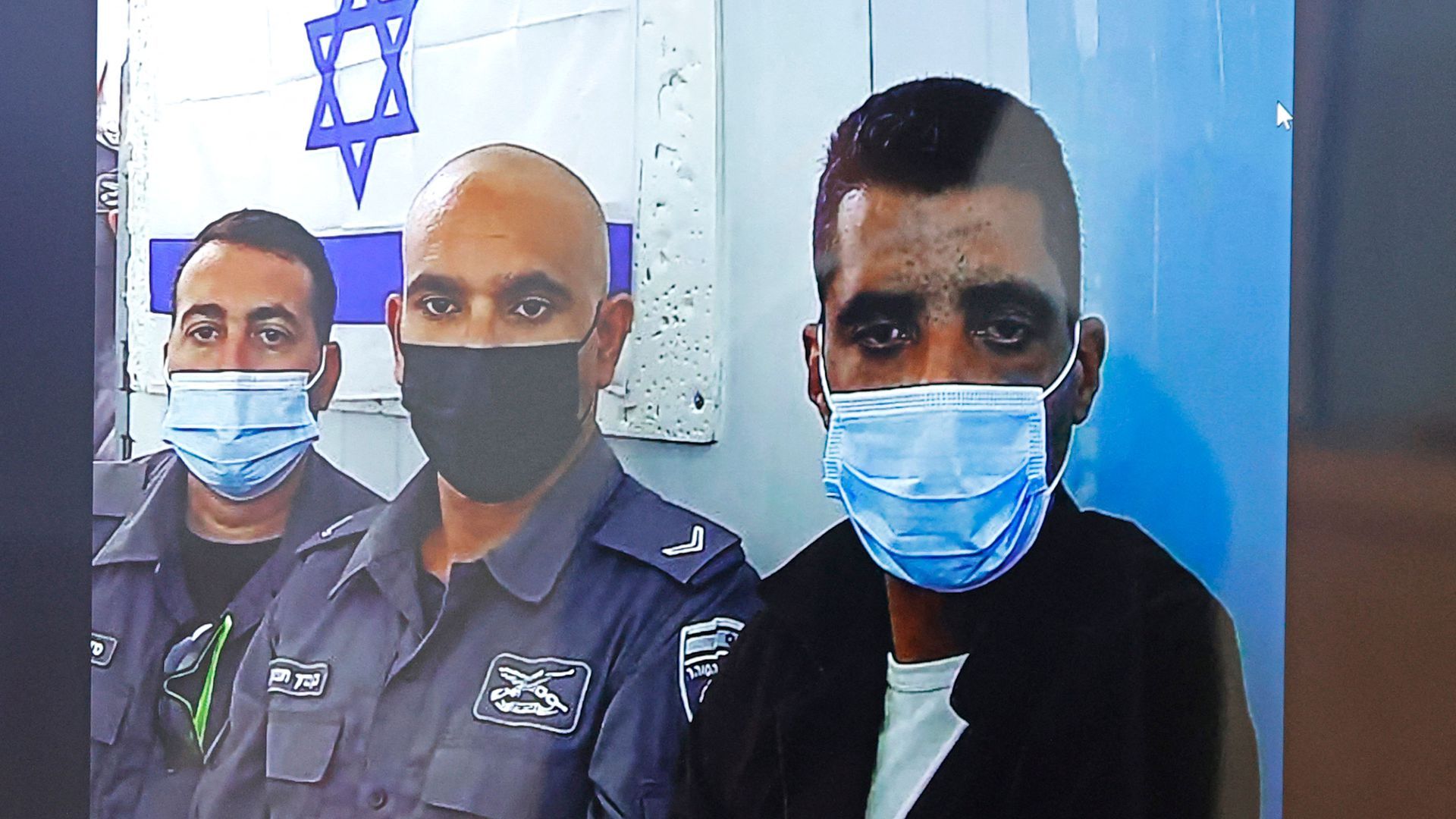 Zakaria Zubeidi (right) attends a virtual court hearing. His son was one of the teens arrested. Photo: Jack Guez/AFP via Getty