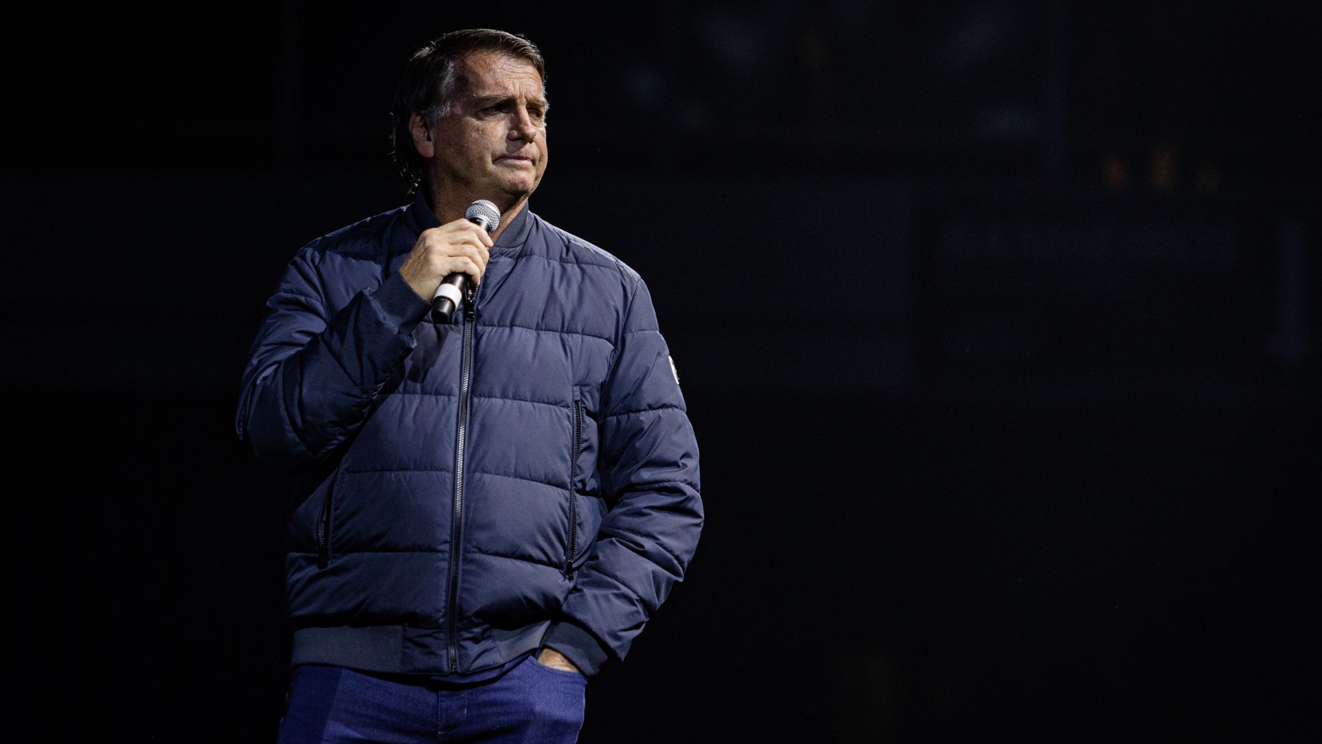 Jair Bolsonaro speaks on stage at a CPAC Brazil event.